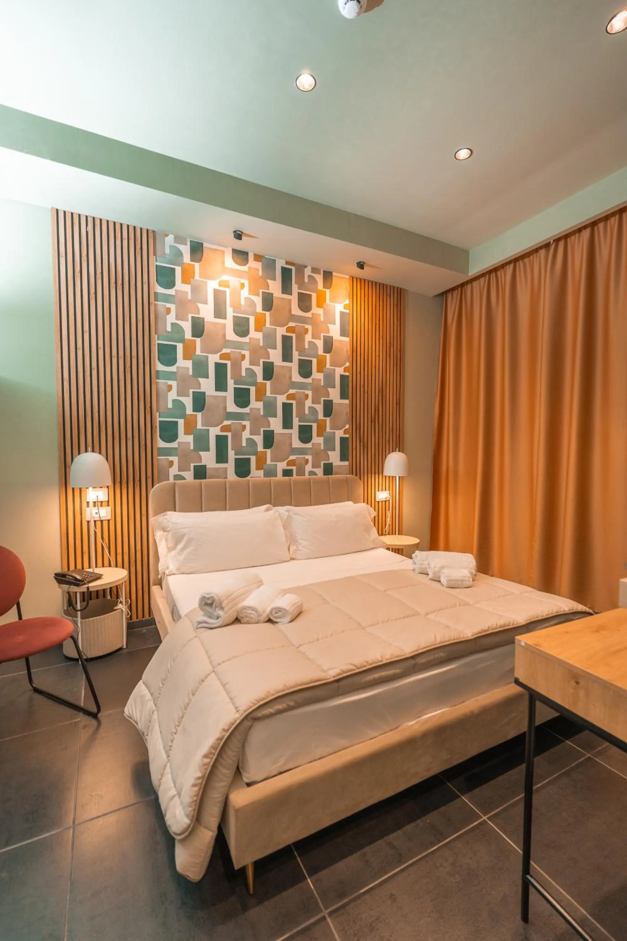 Bed in Noah Gate Hotel & Suites