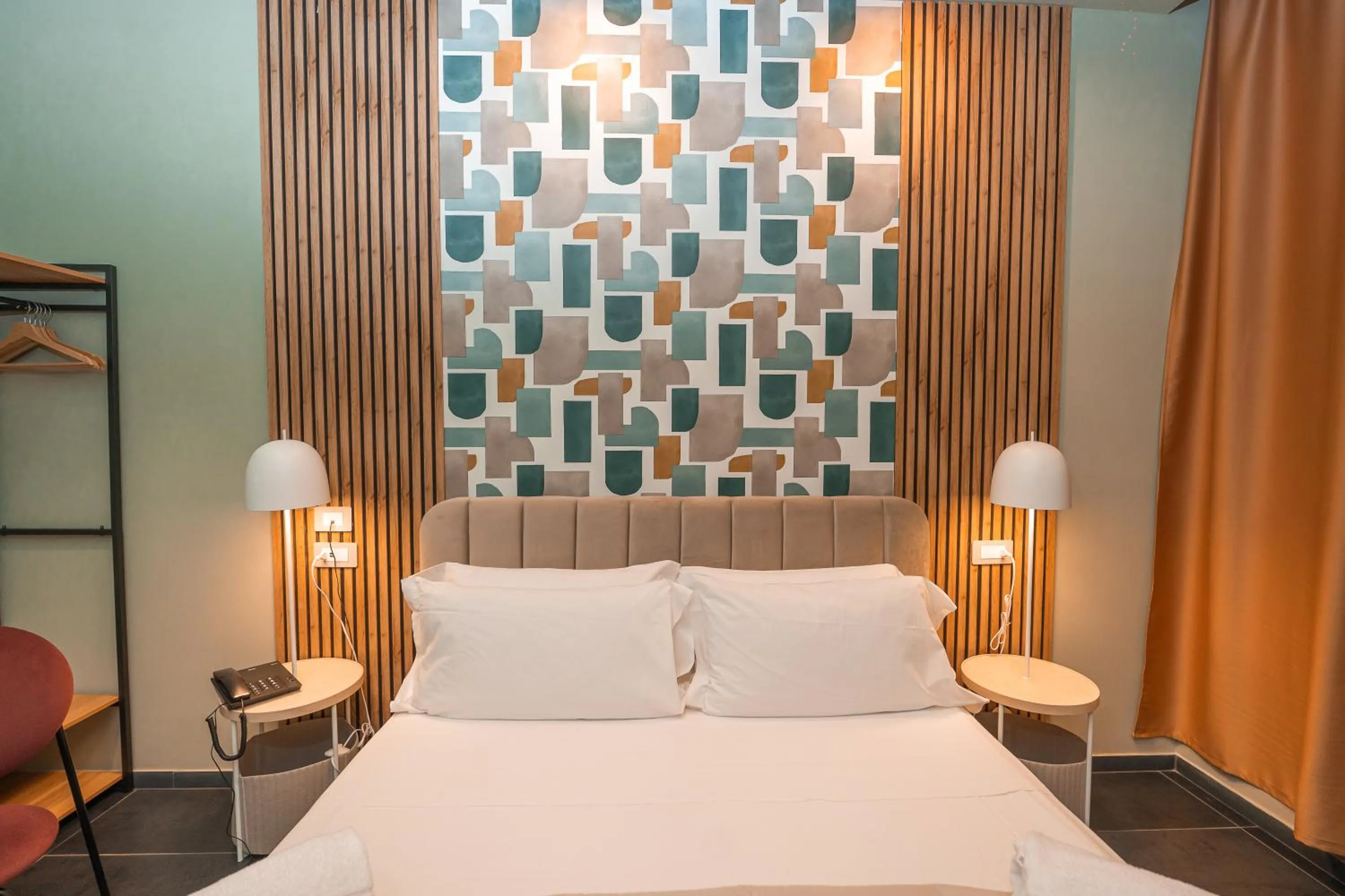 Bed in Noah Gate Hotel & Suites