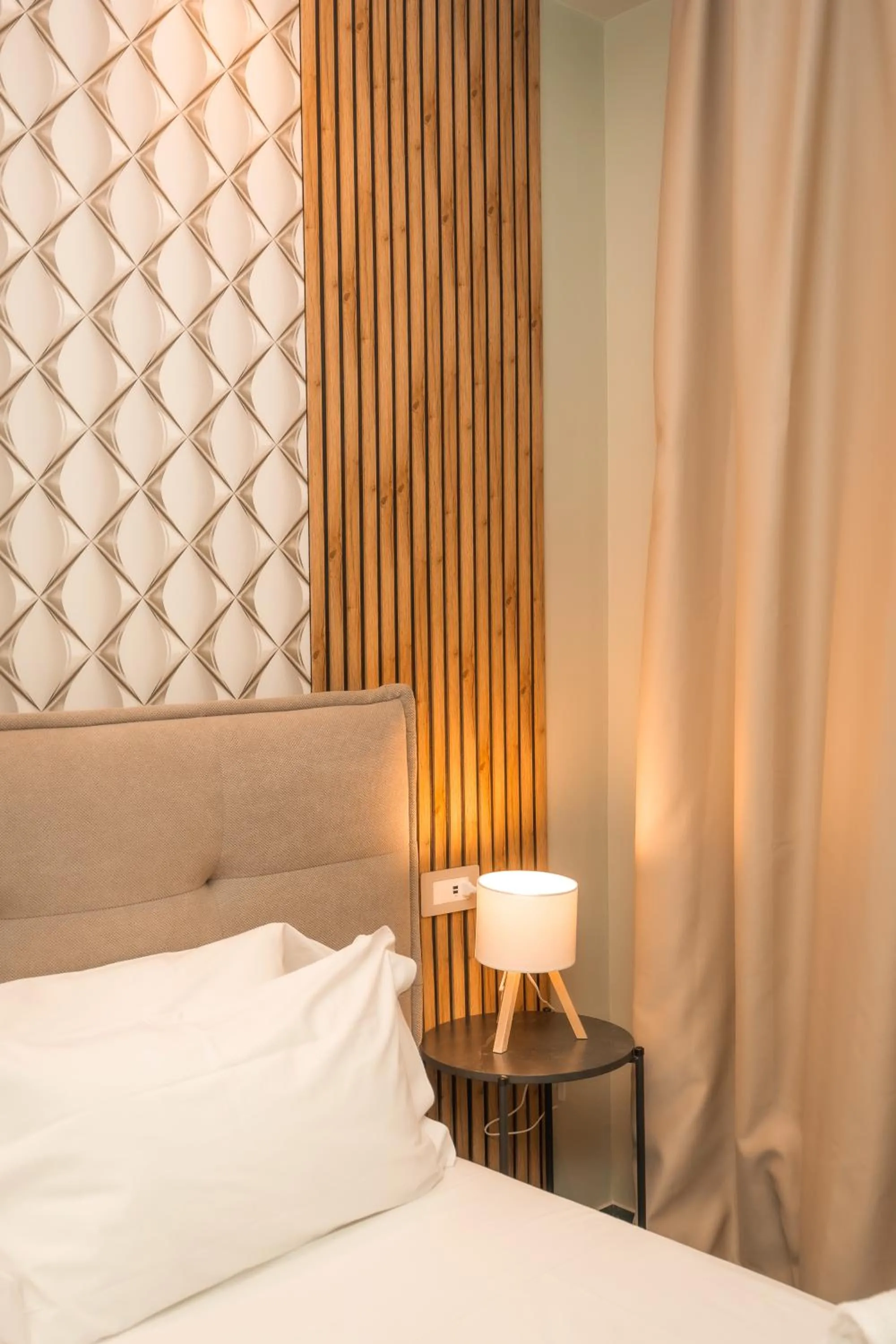 Bed in Noah Gate Hotel & Suites