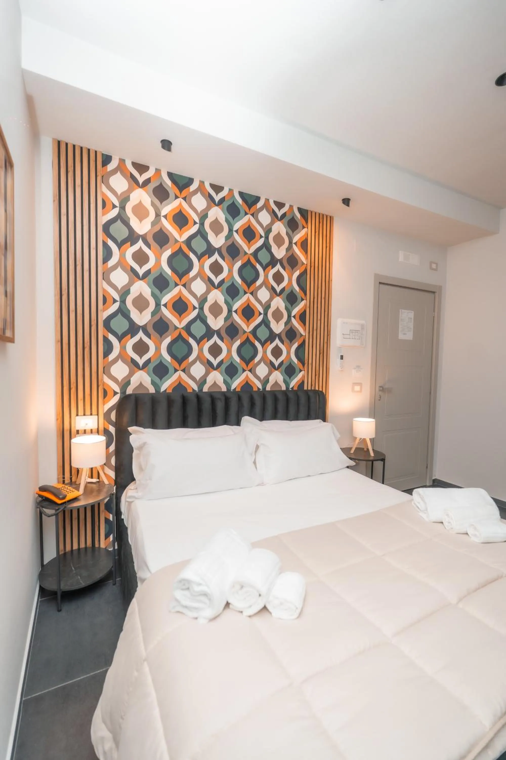 Bed in Noah Gate Hotel & Suites