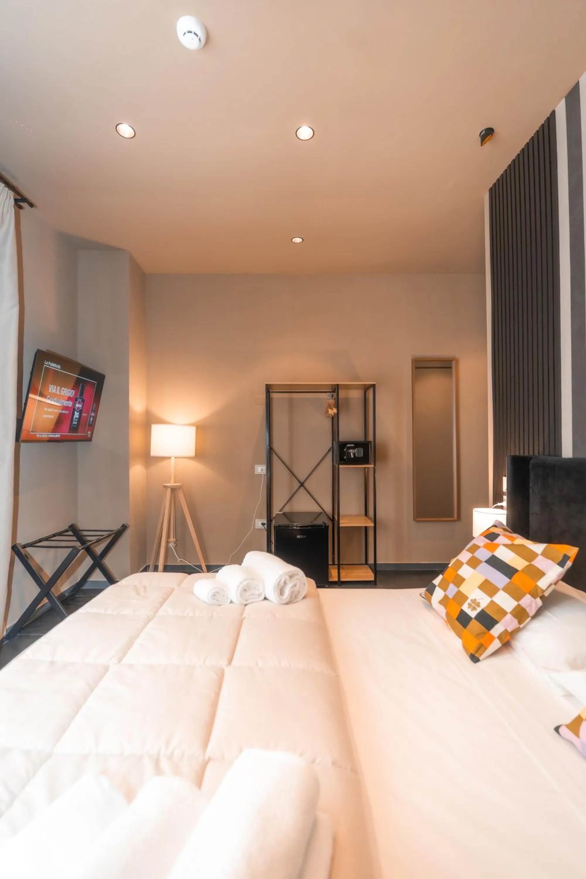 Bed in Noah Gate Hotel & Suites