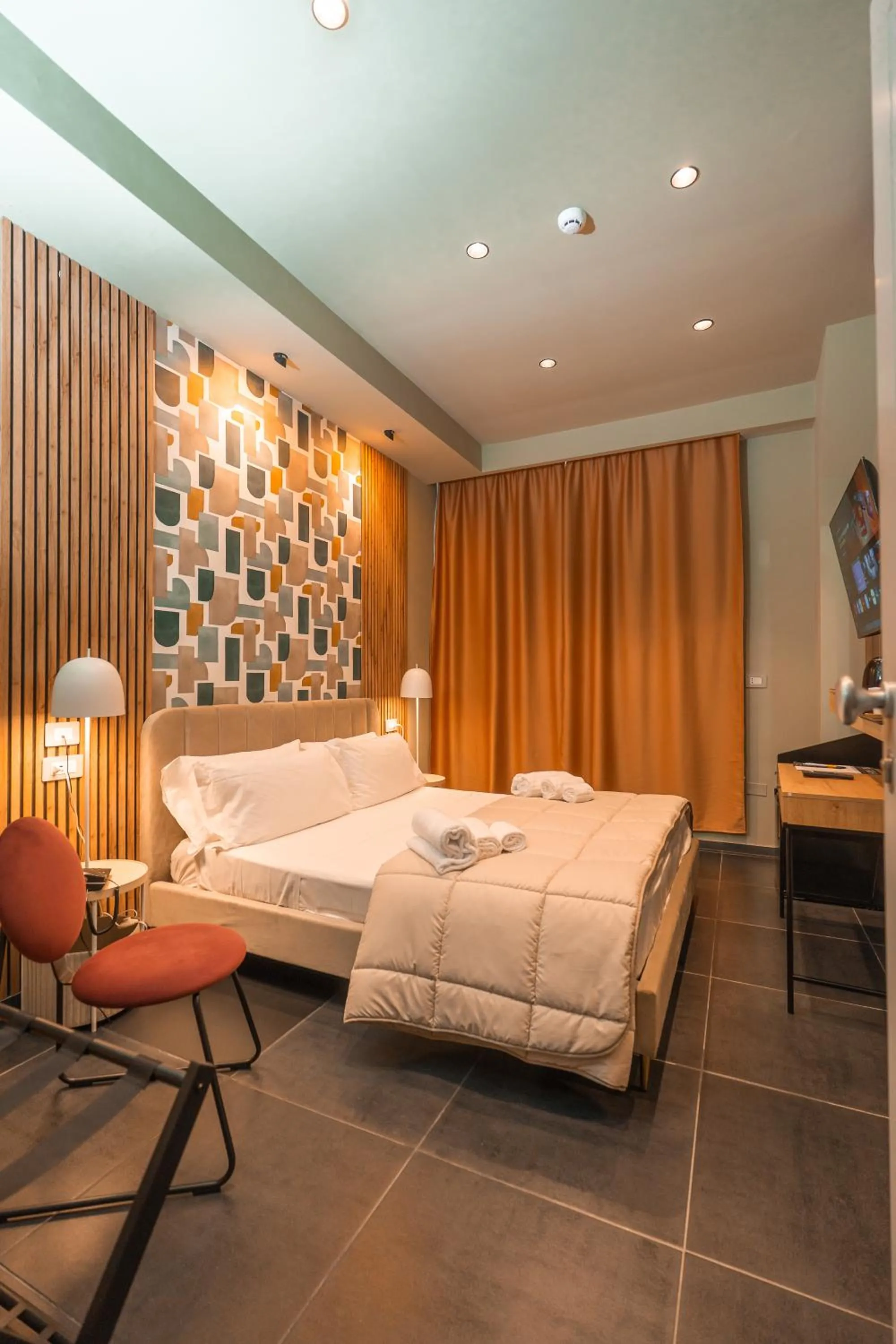 Bed in Noah Gate Hotel & Suites