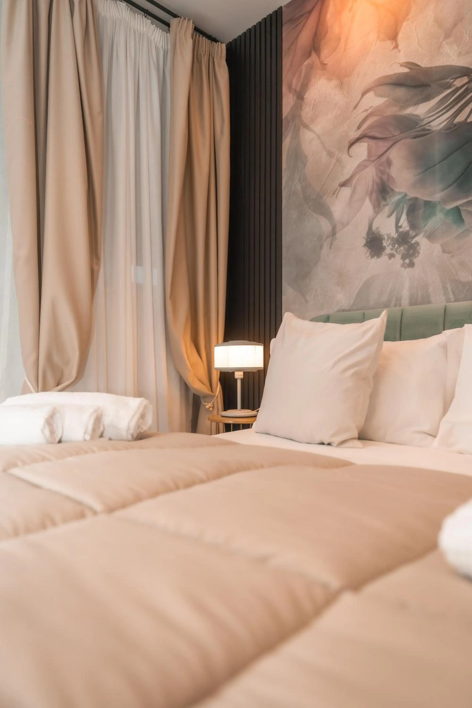Bed in Noah Gate Hotel & Suites
