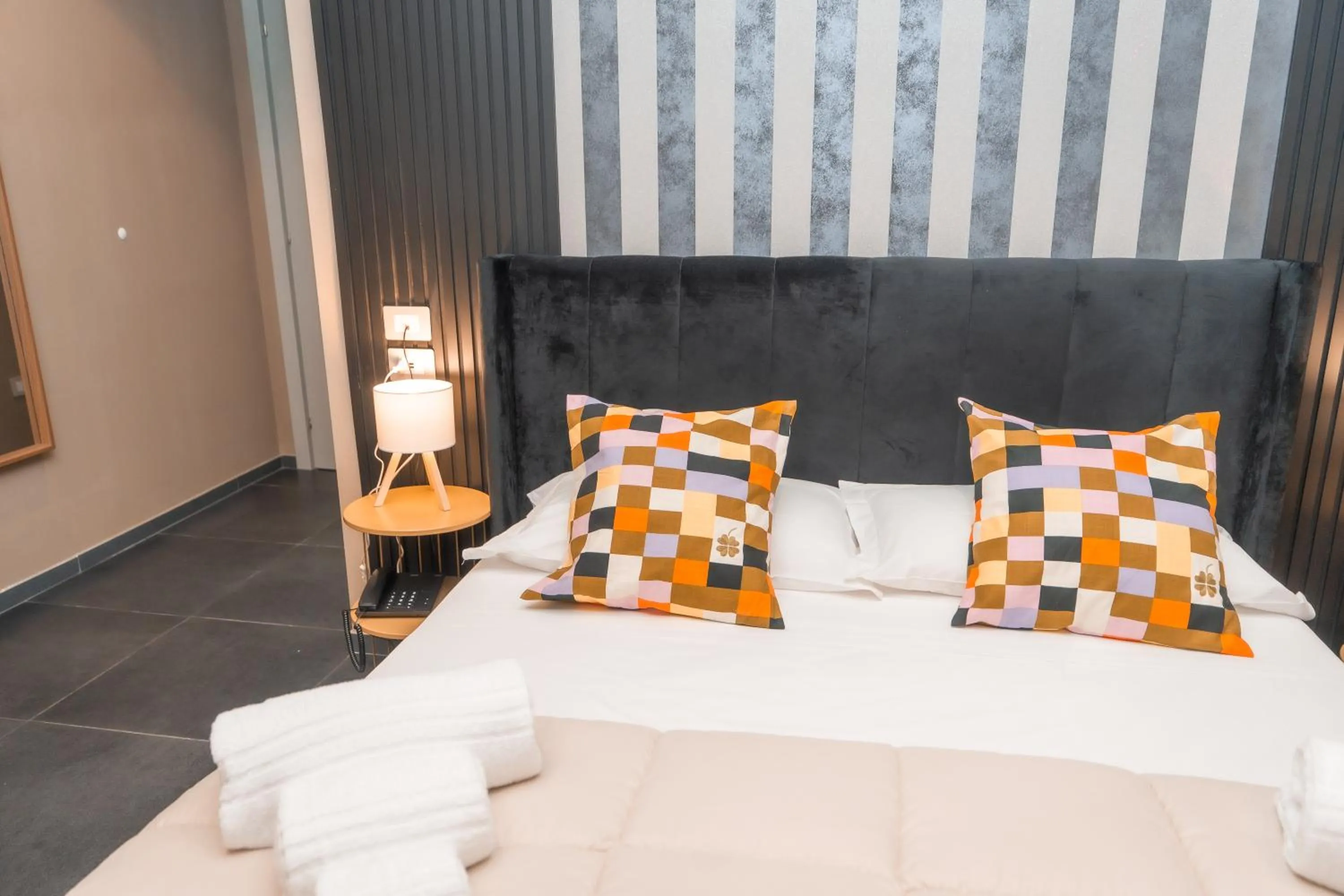 Bed in Noah Gate Hotel & Suites