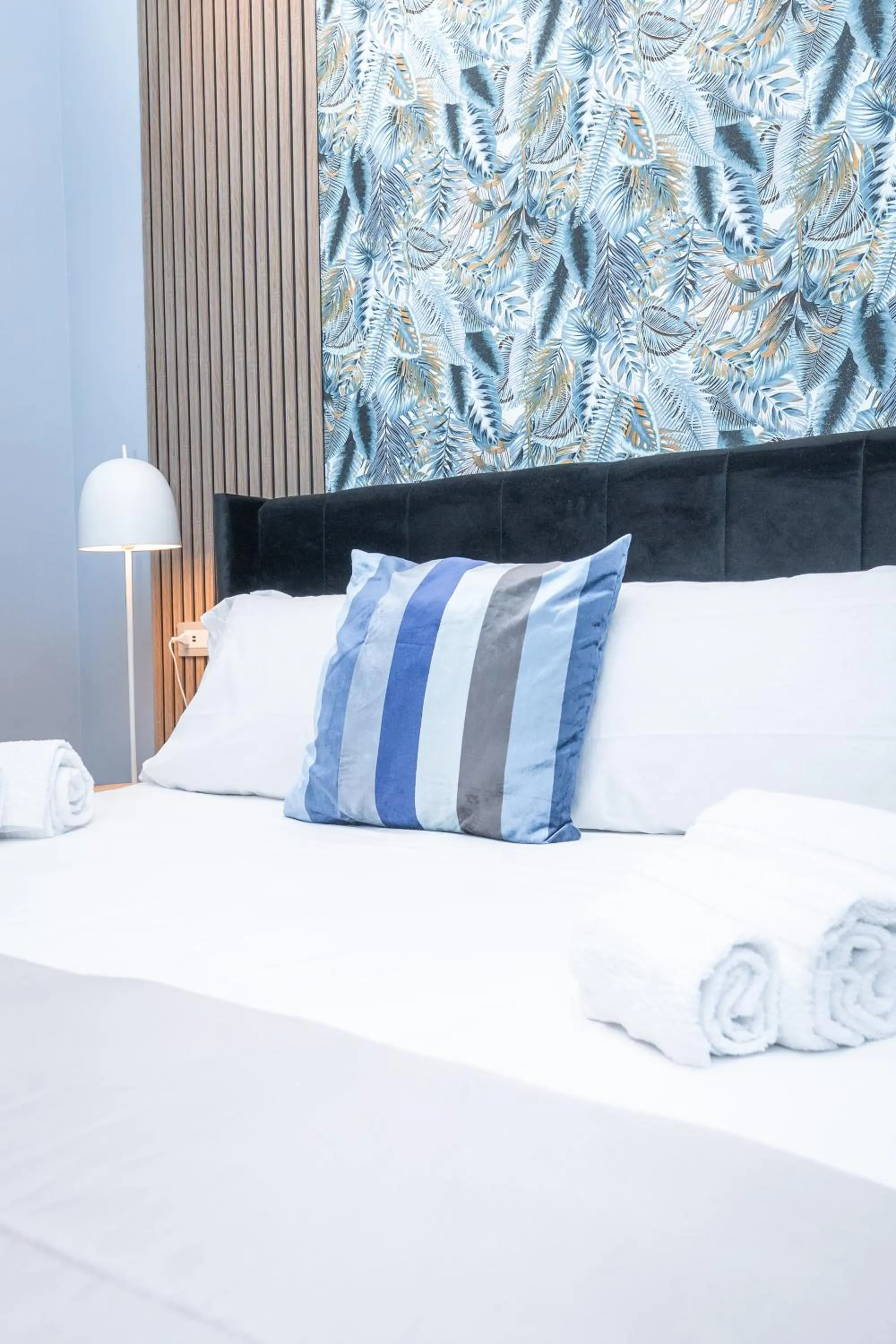 Bed in Noah Gate Hotel & Suites