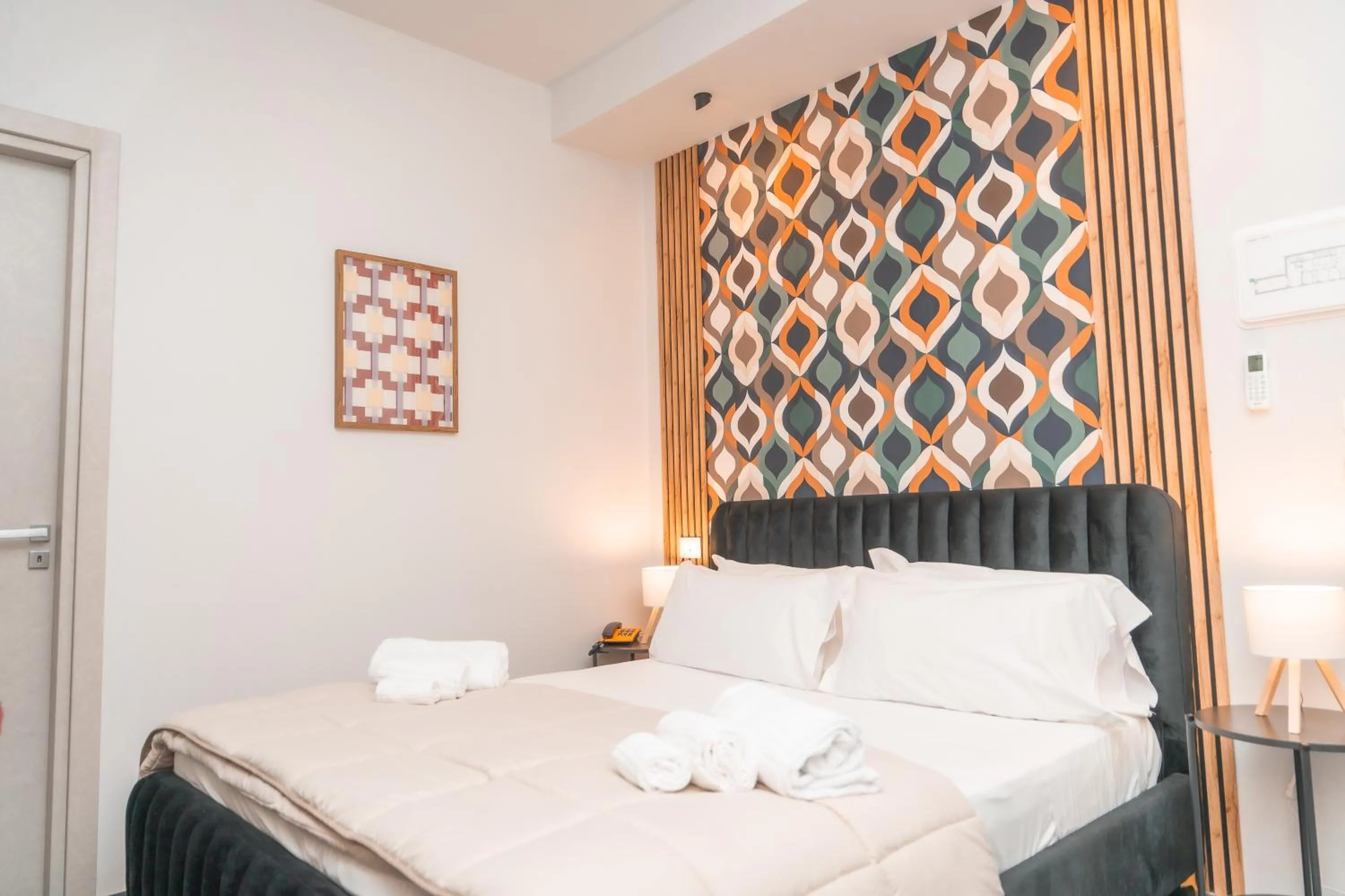 Bed in Noah Gate Hotel & Suites