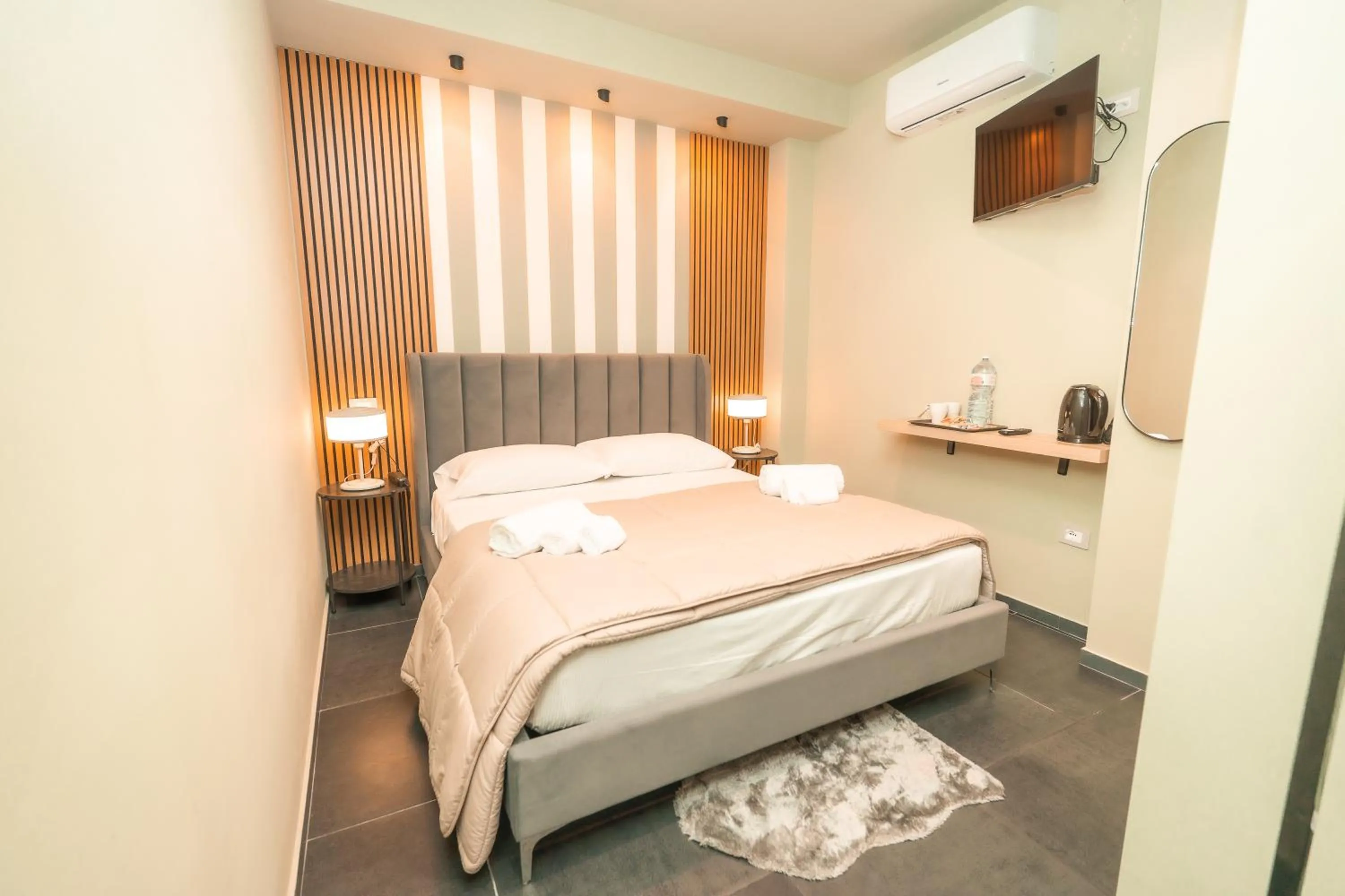 Bed in Noah Gate Hotel & Suites