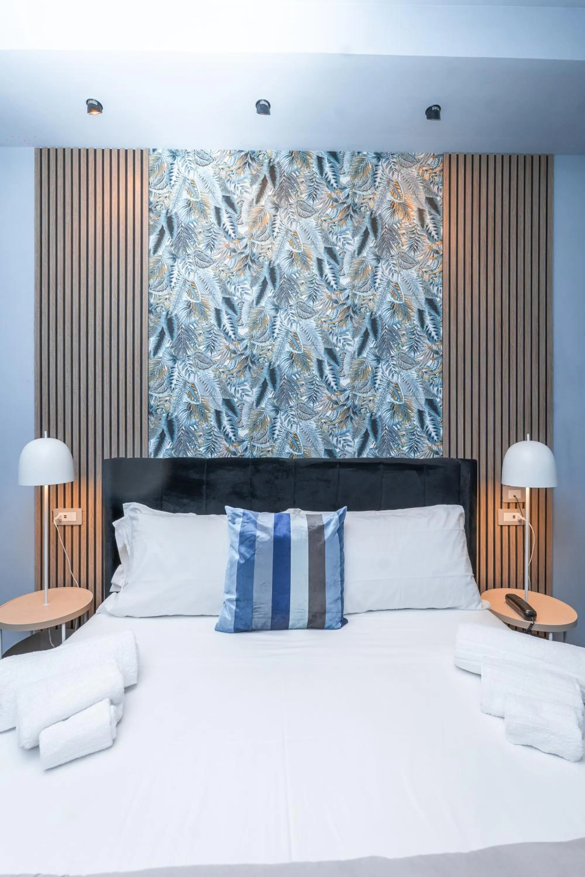 Bed in Noah Gate Hotel & Suites