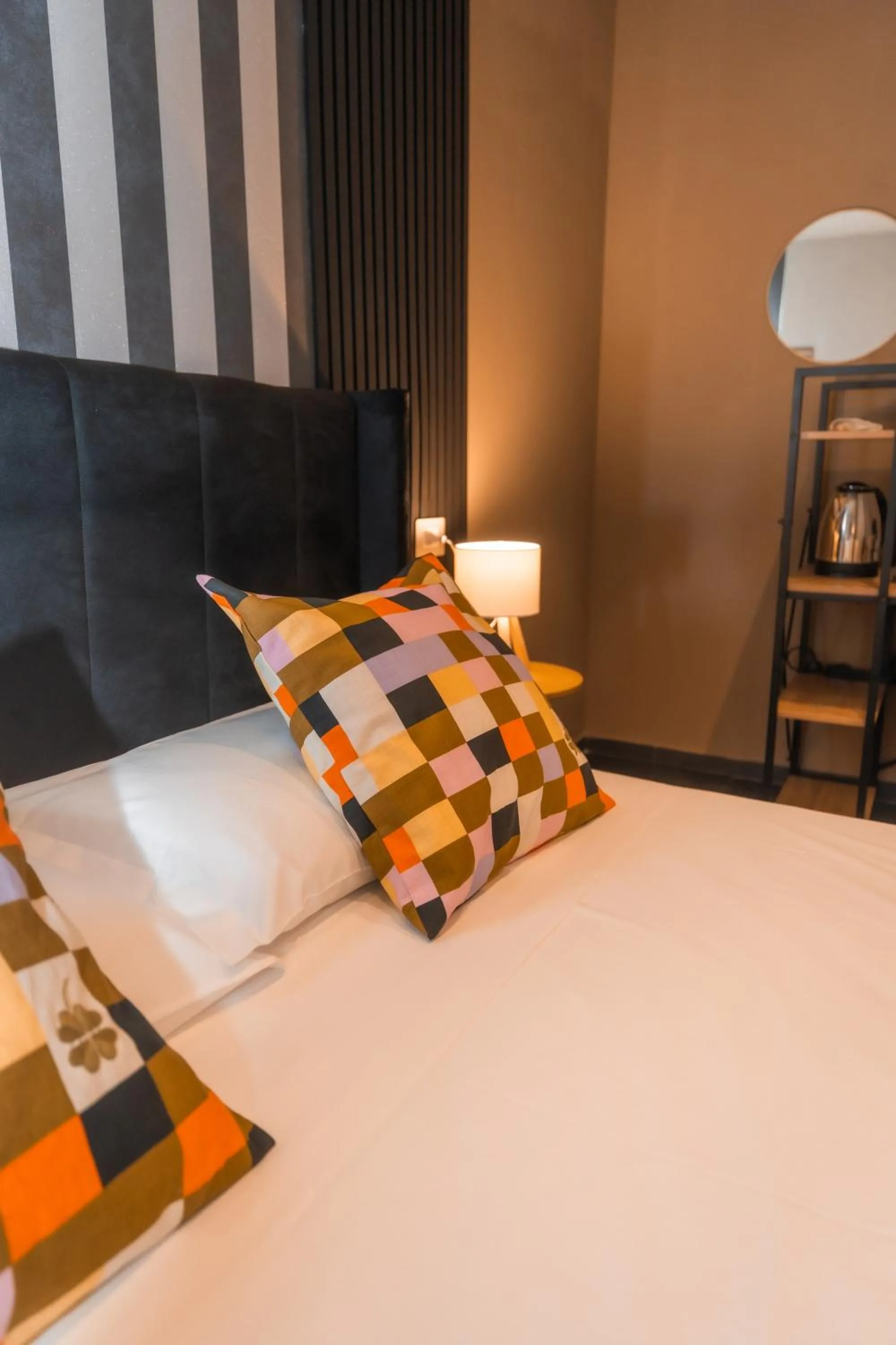 Bed in Noah Gate Hotel & Suites