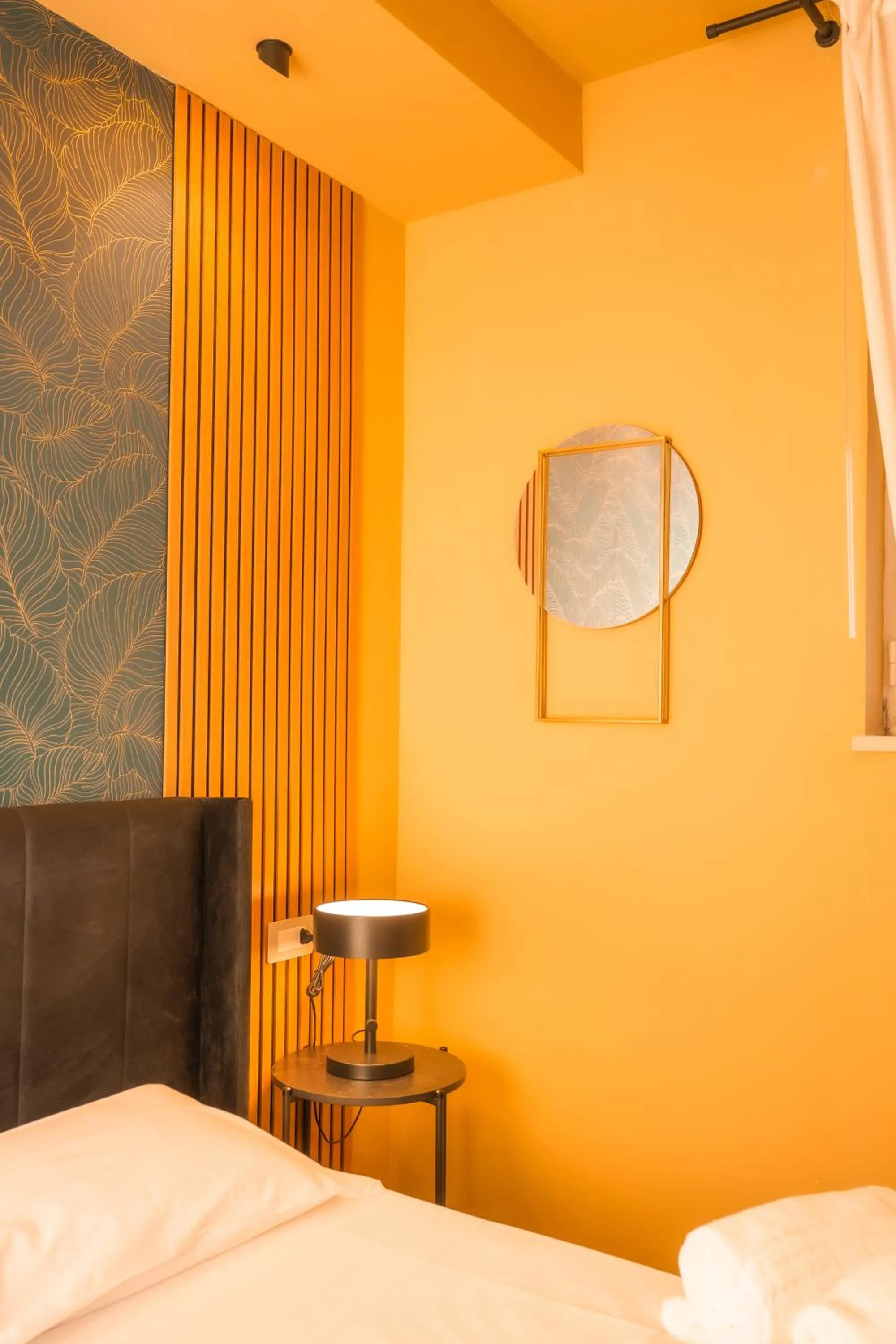 Bed in Noah Gate Hotel & Suites