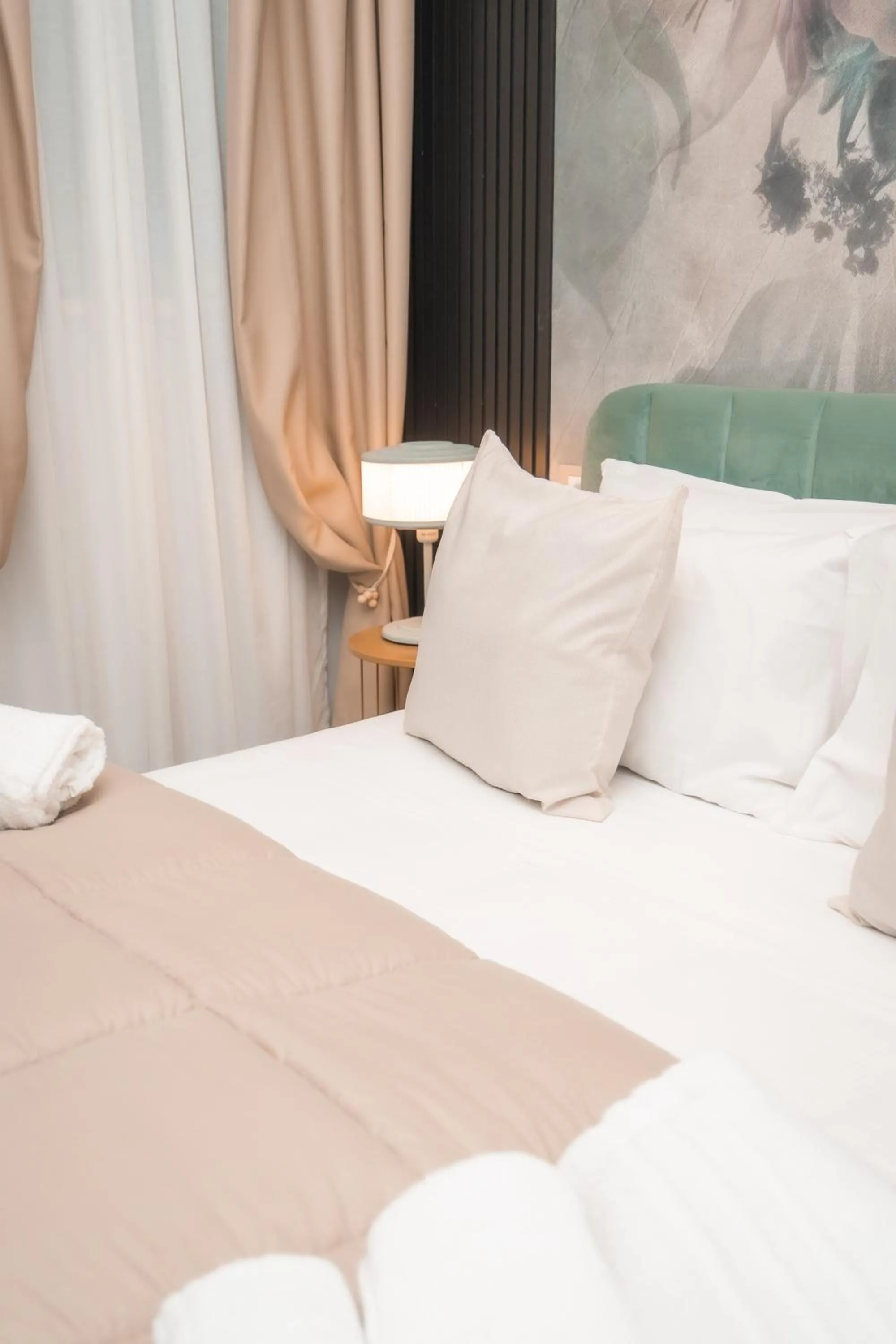 Bed in Noah Gate Hotel & Suites