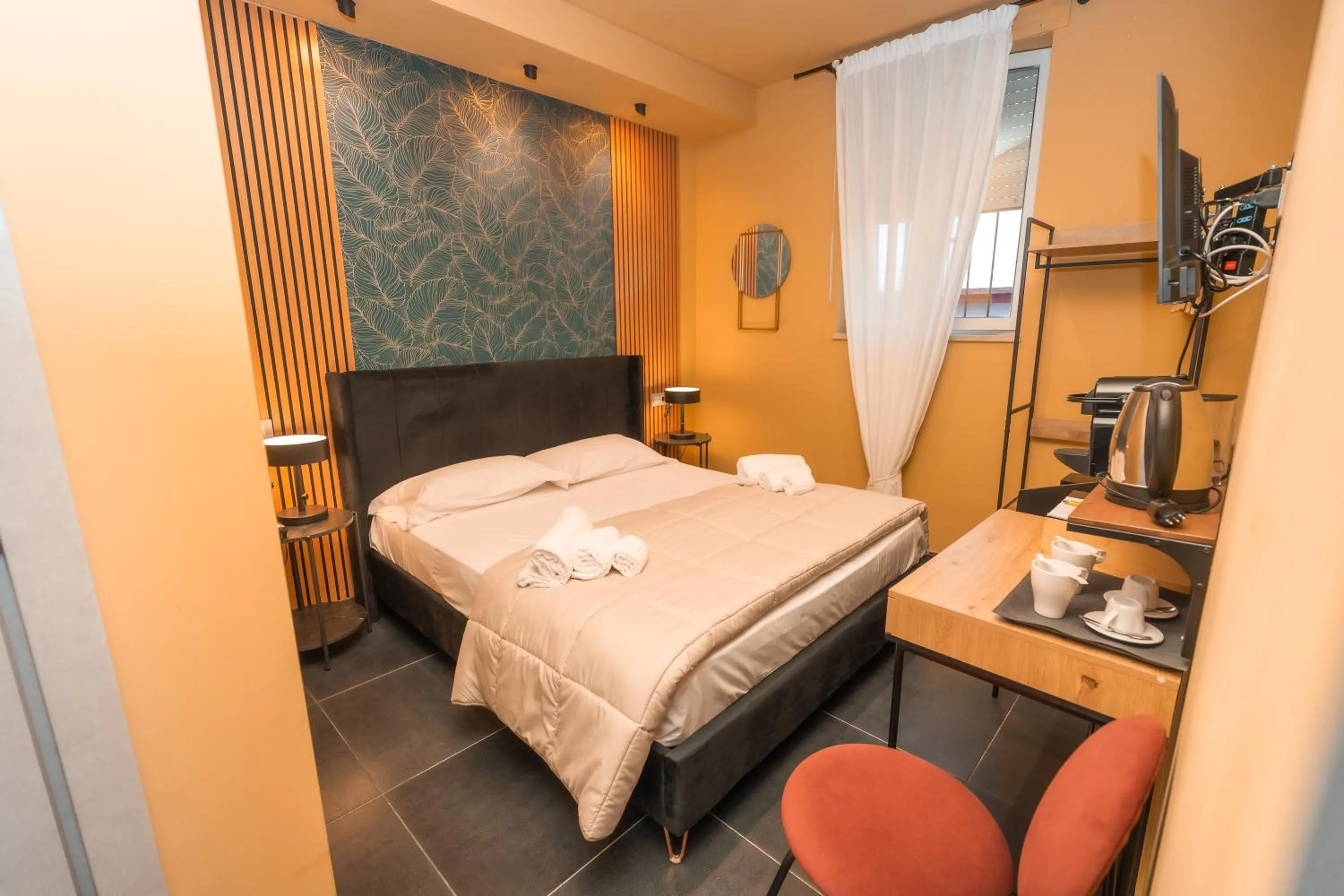 Bed in Noah Gate Hotel & Suites