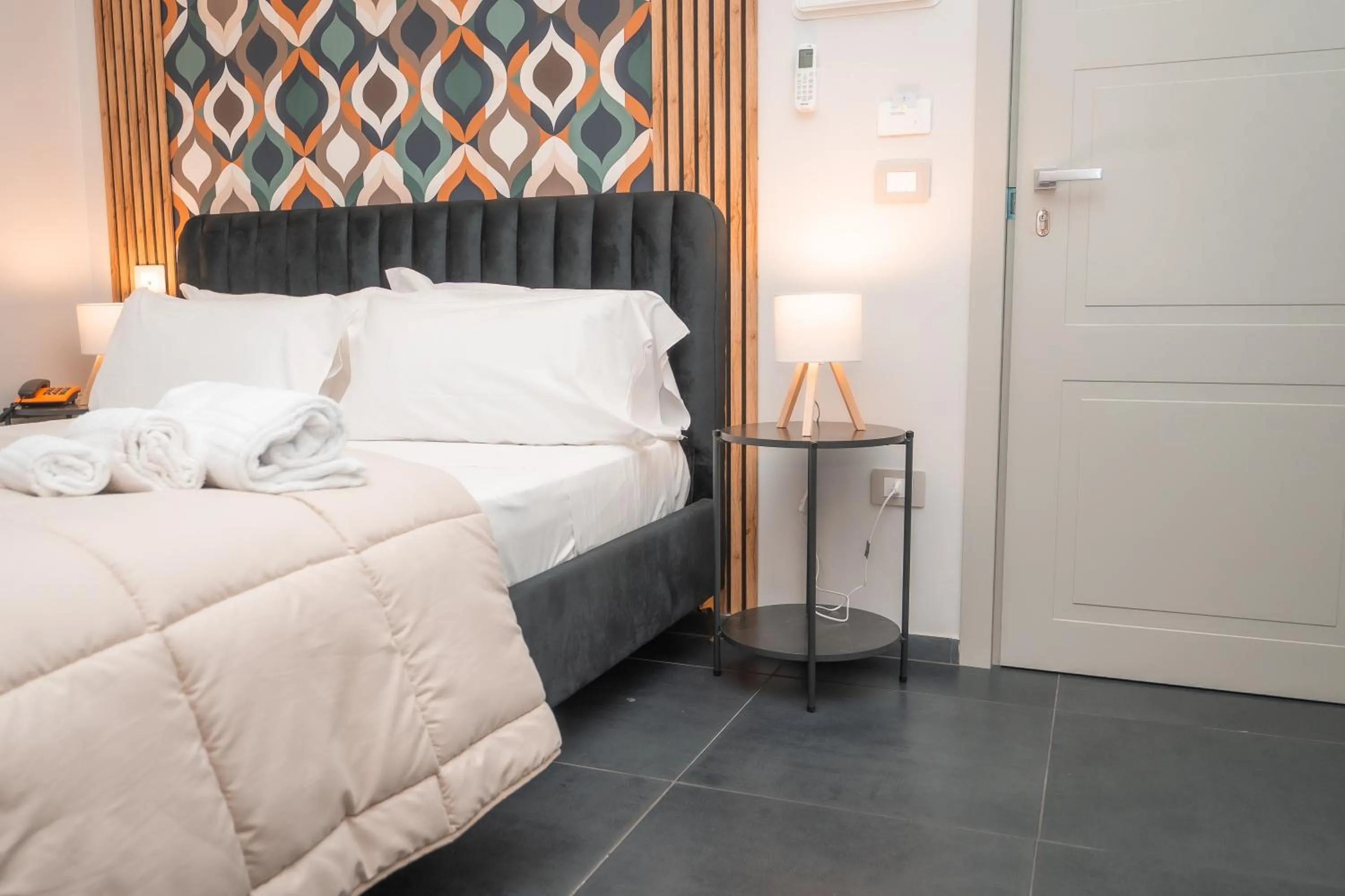 Bed in Noah Gate Hotel & Suites