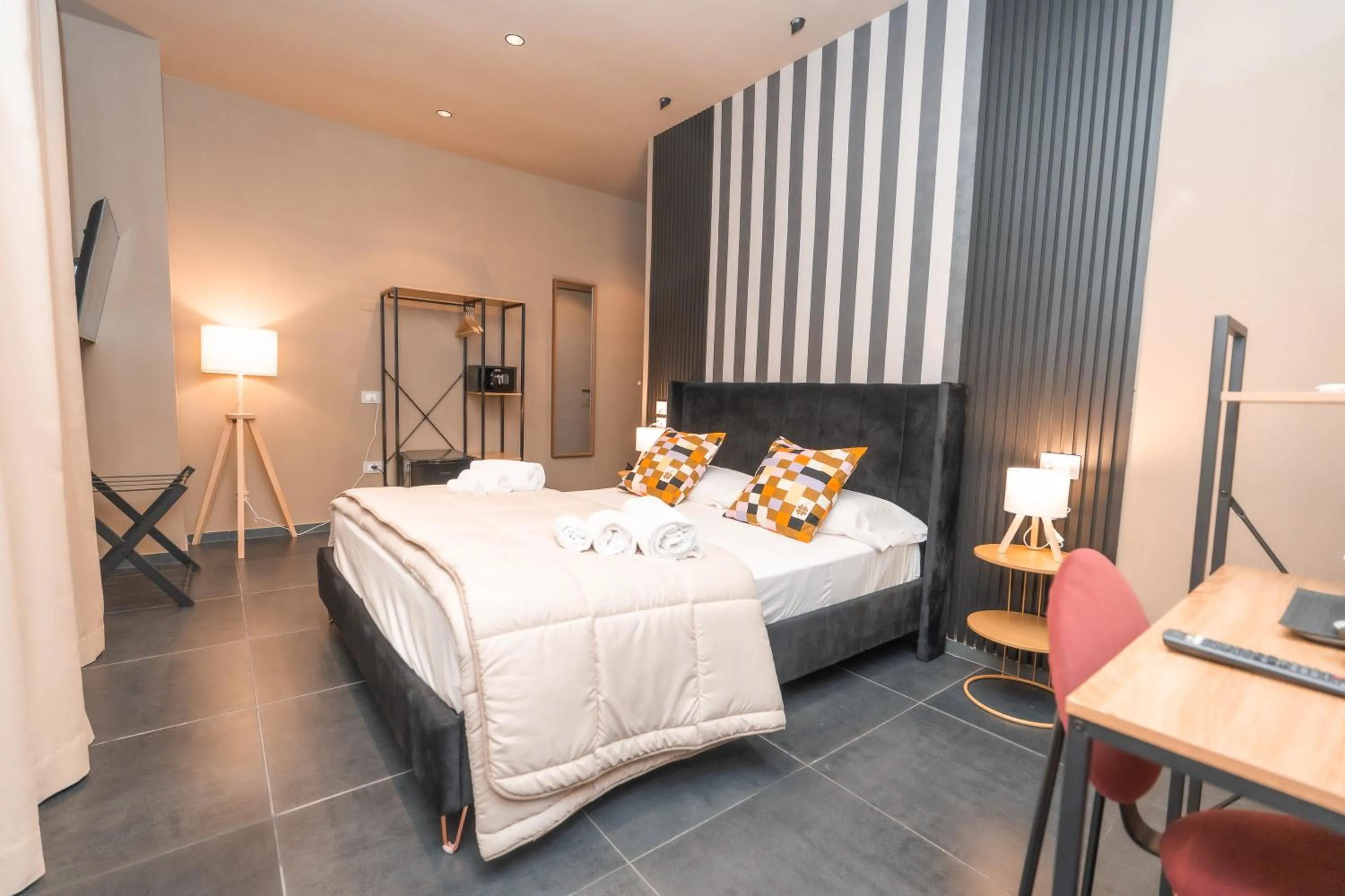 Bed in Noah Gate Hotel & Suites