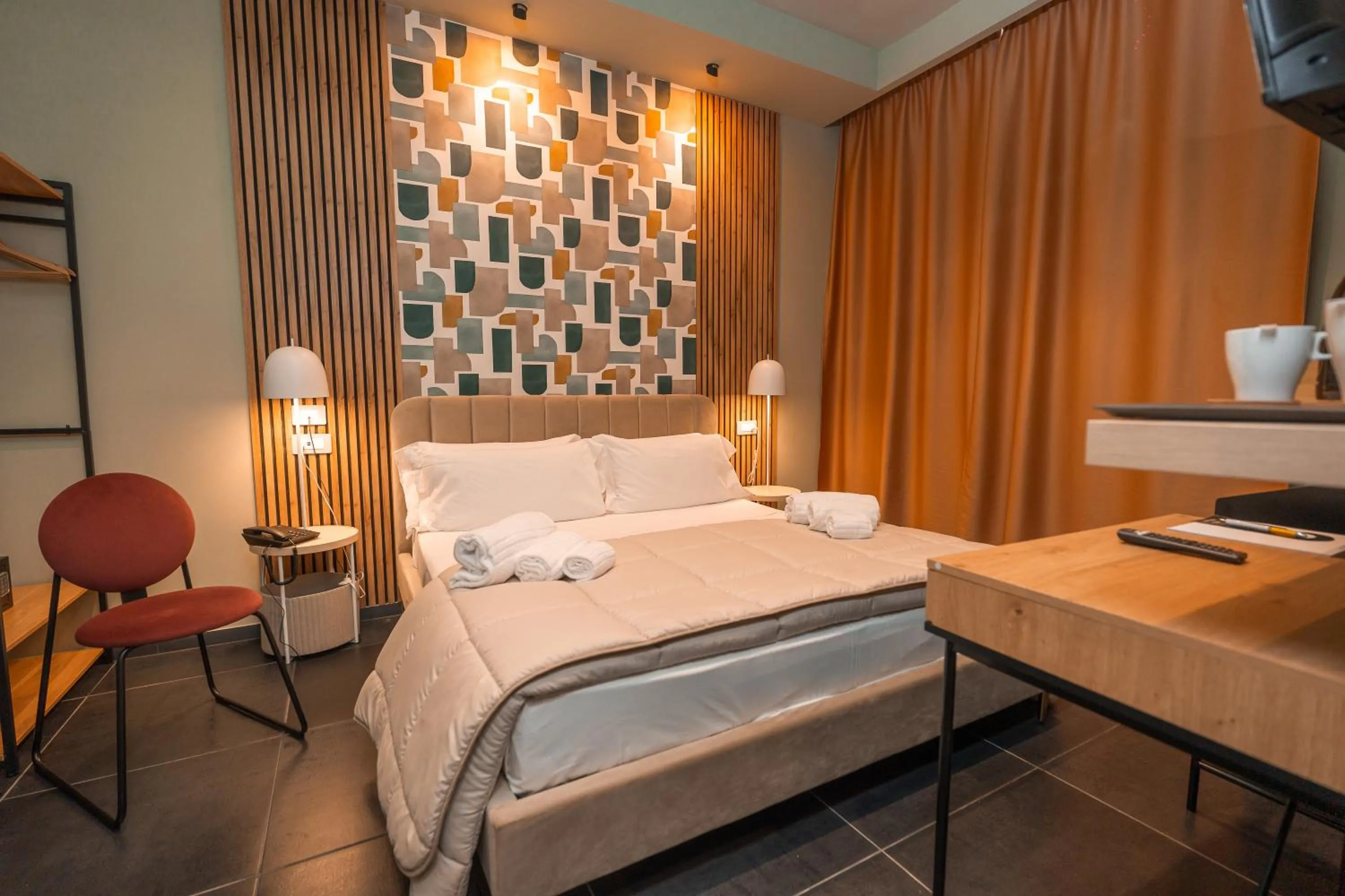 Bed in Noah Gate Hotel & Suites