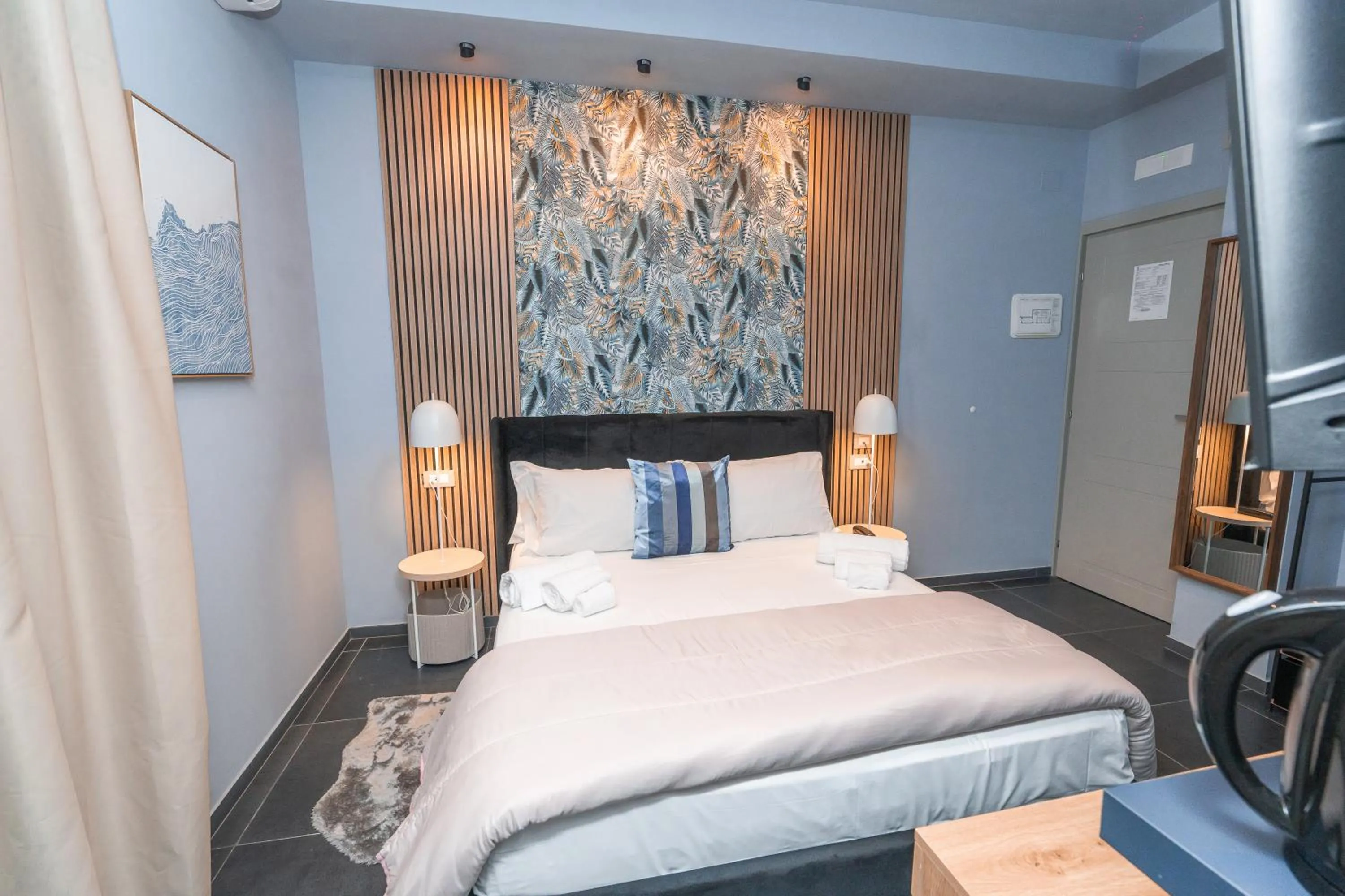 Bed in Noah Gate Hotel & Suites