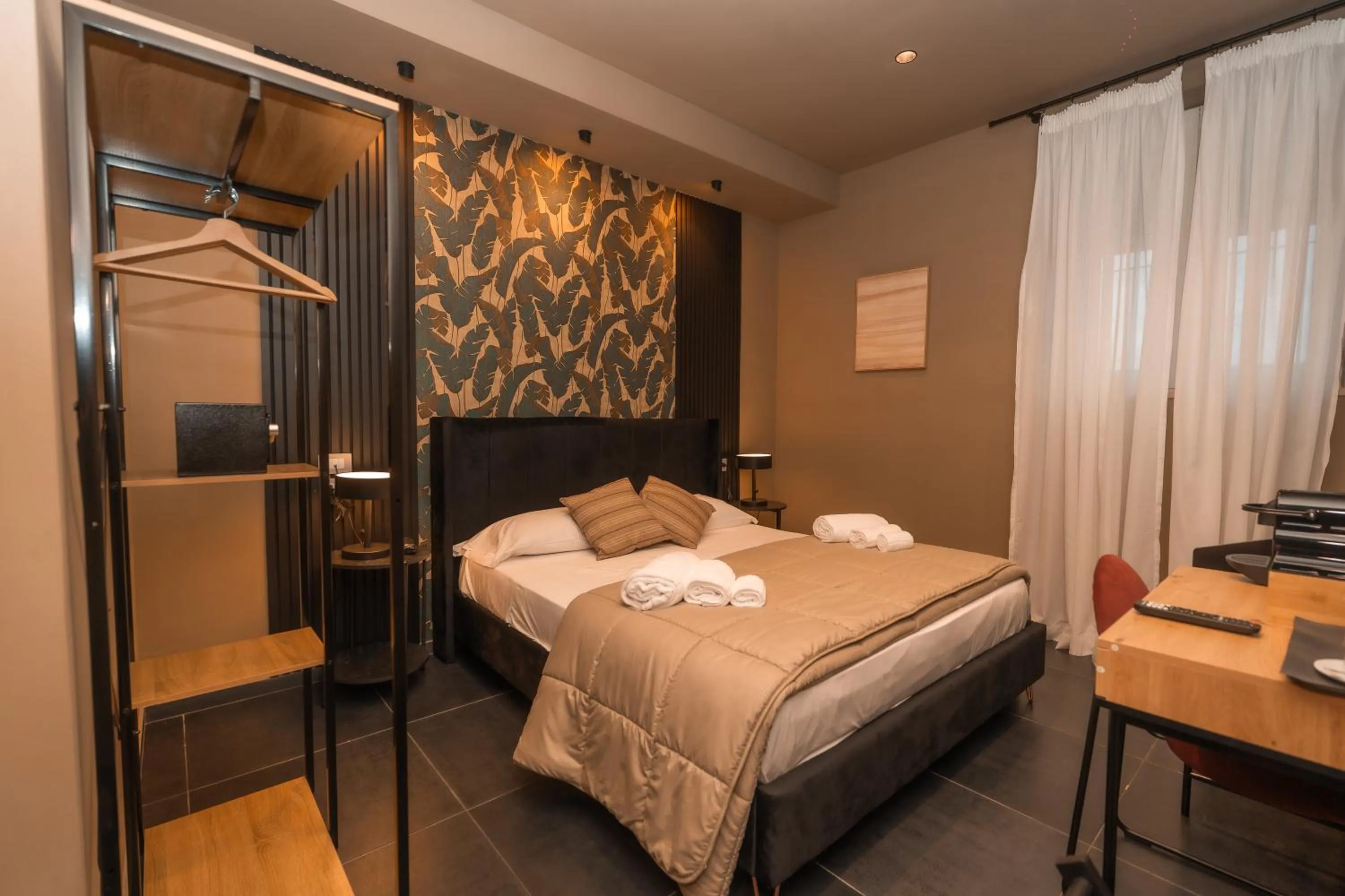 Bed in Noah Gate Hotel & Suites