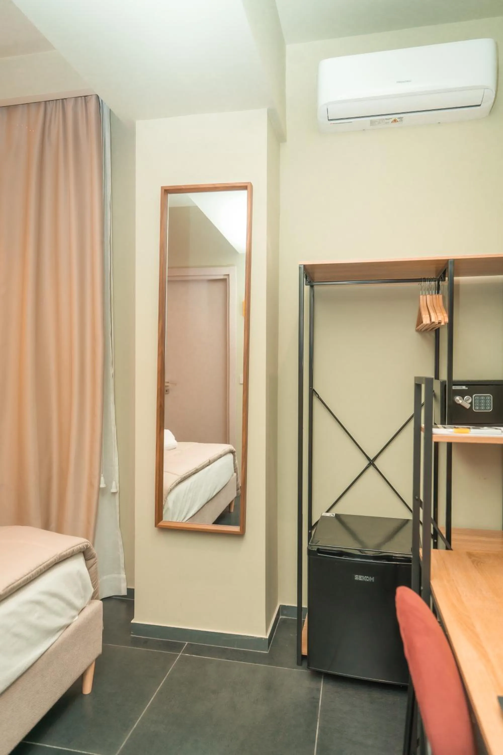 Bed in Noah Gate Hotel & Suites