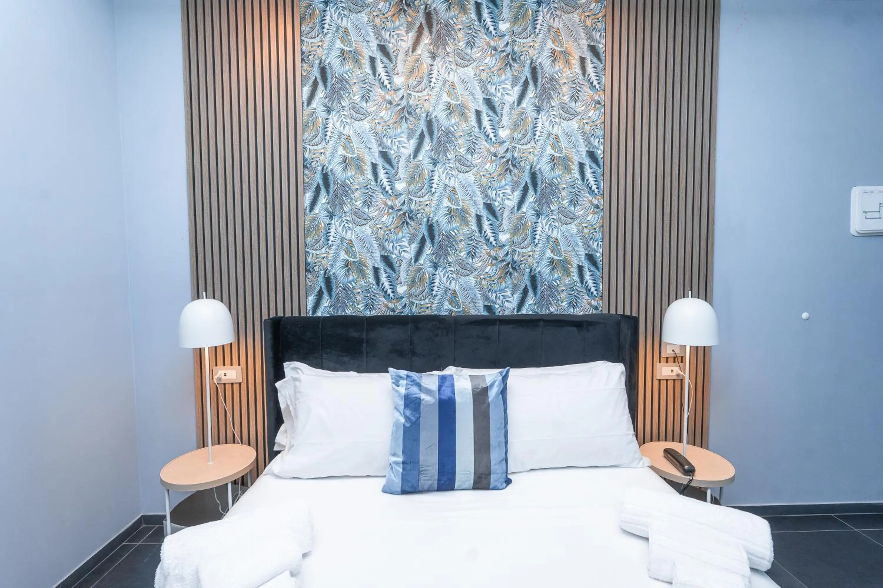 Bed in Noah Gate Hotel & Suites