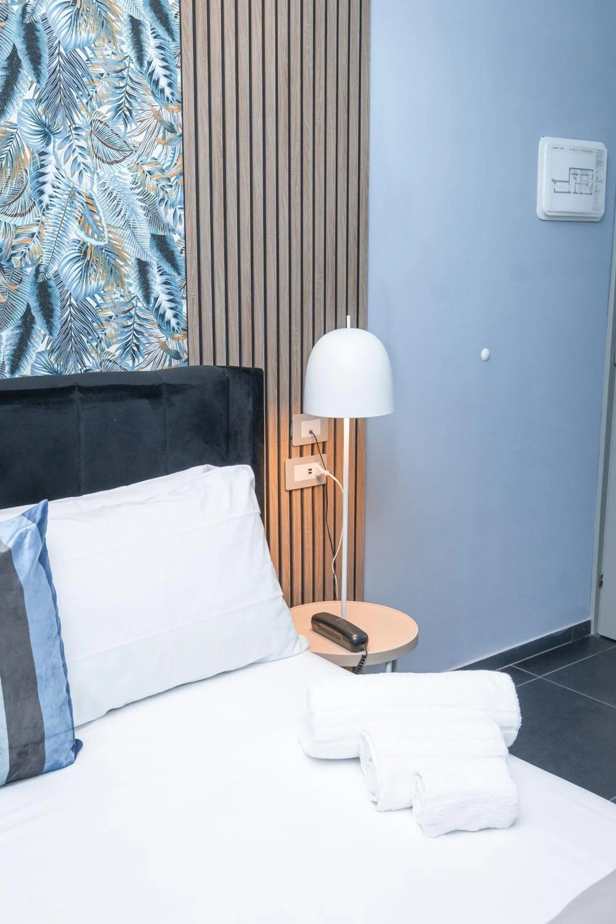 Bed in Noah Gate Hotel & Suites