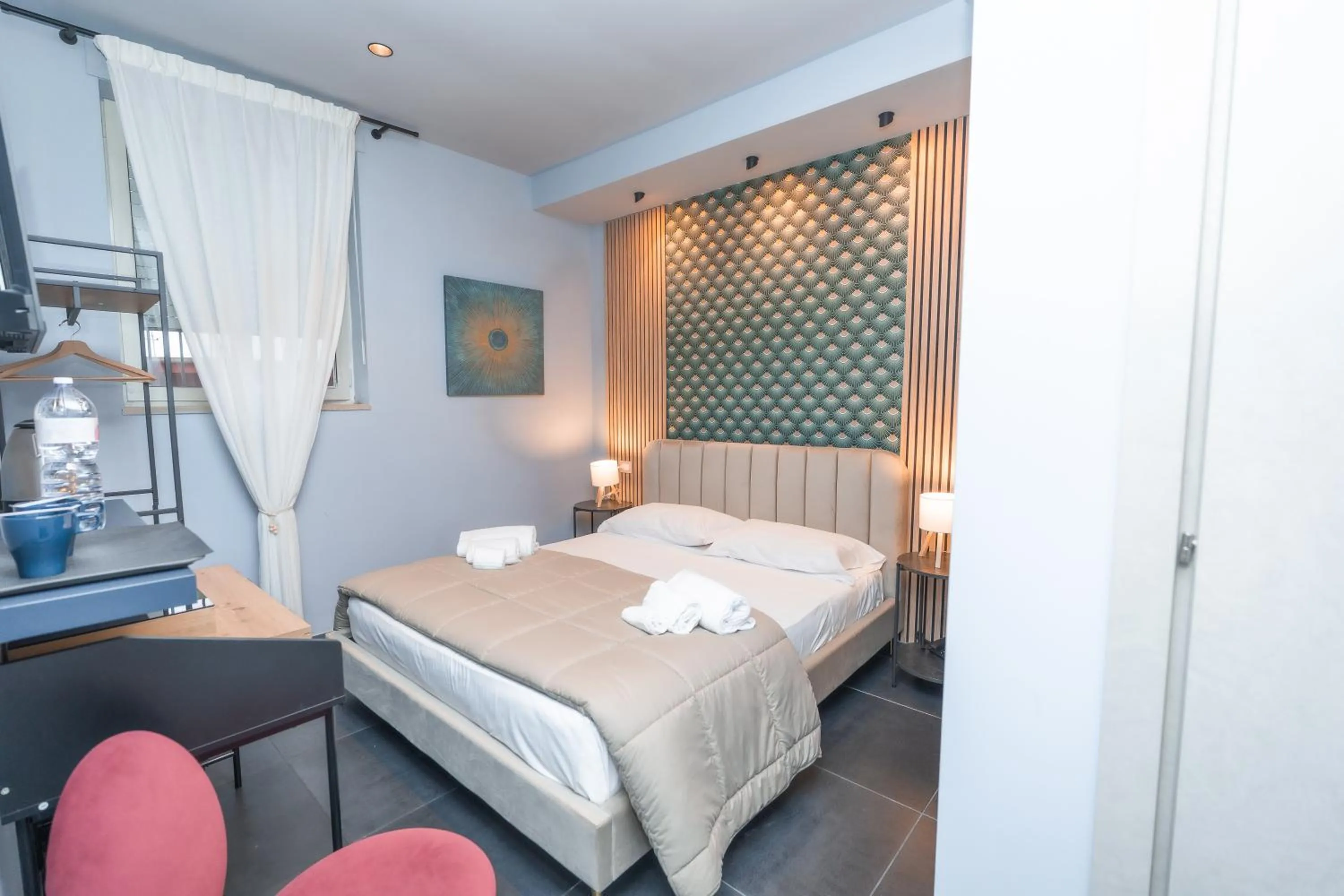 Bed in Noah Gate Hotel & Suites