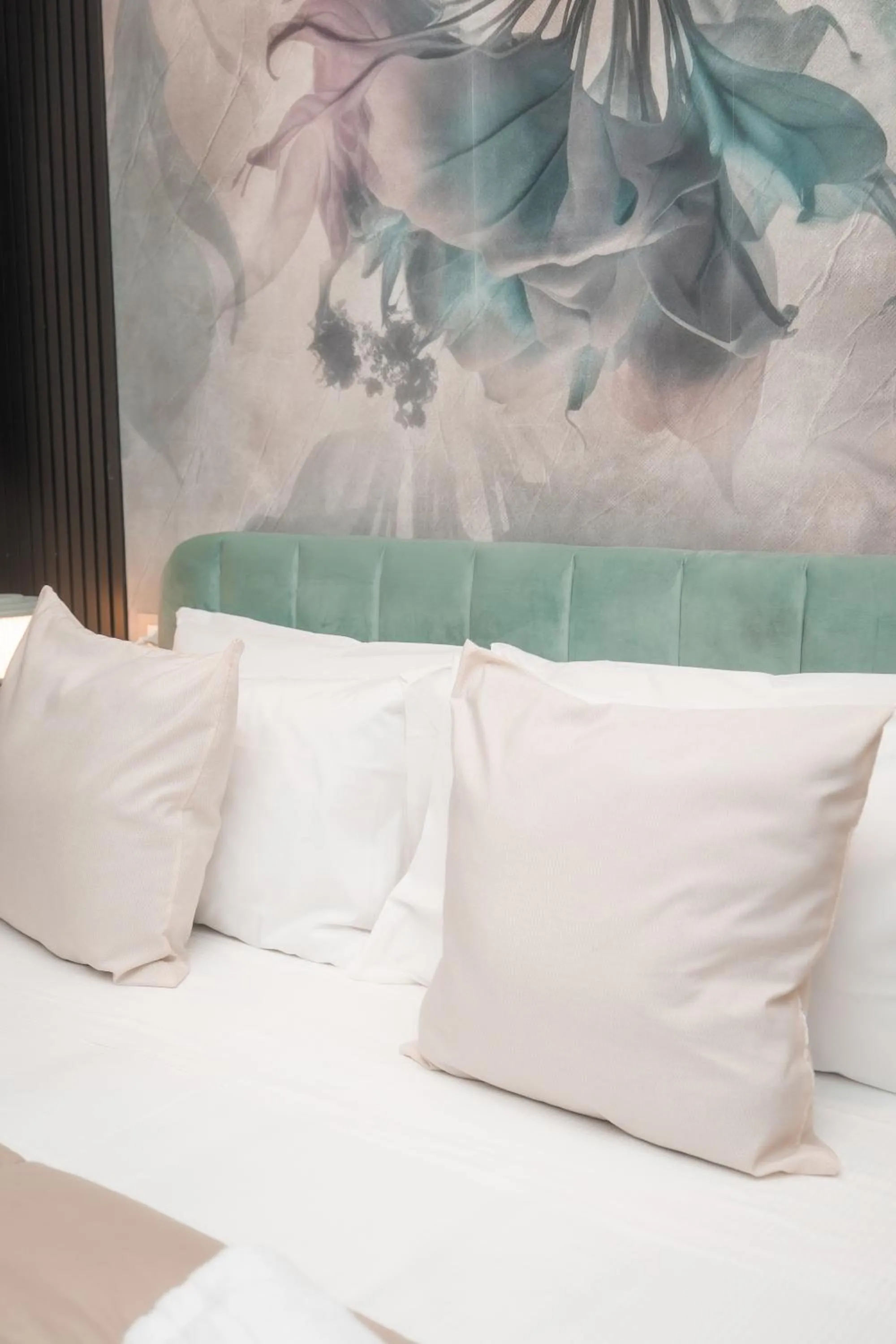 Bed in Noah Gate Hotel & Suites