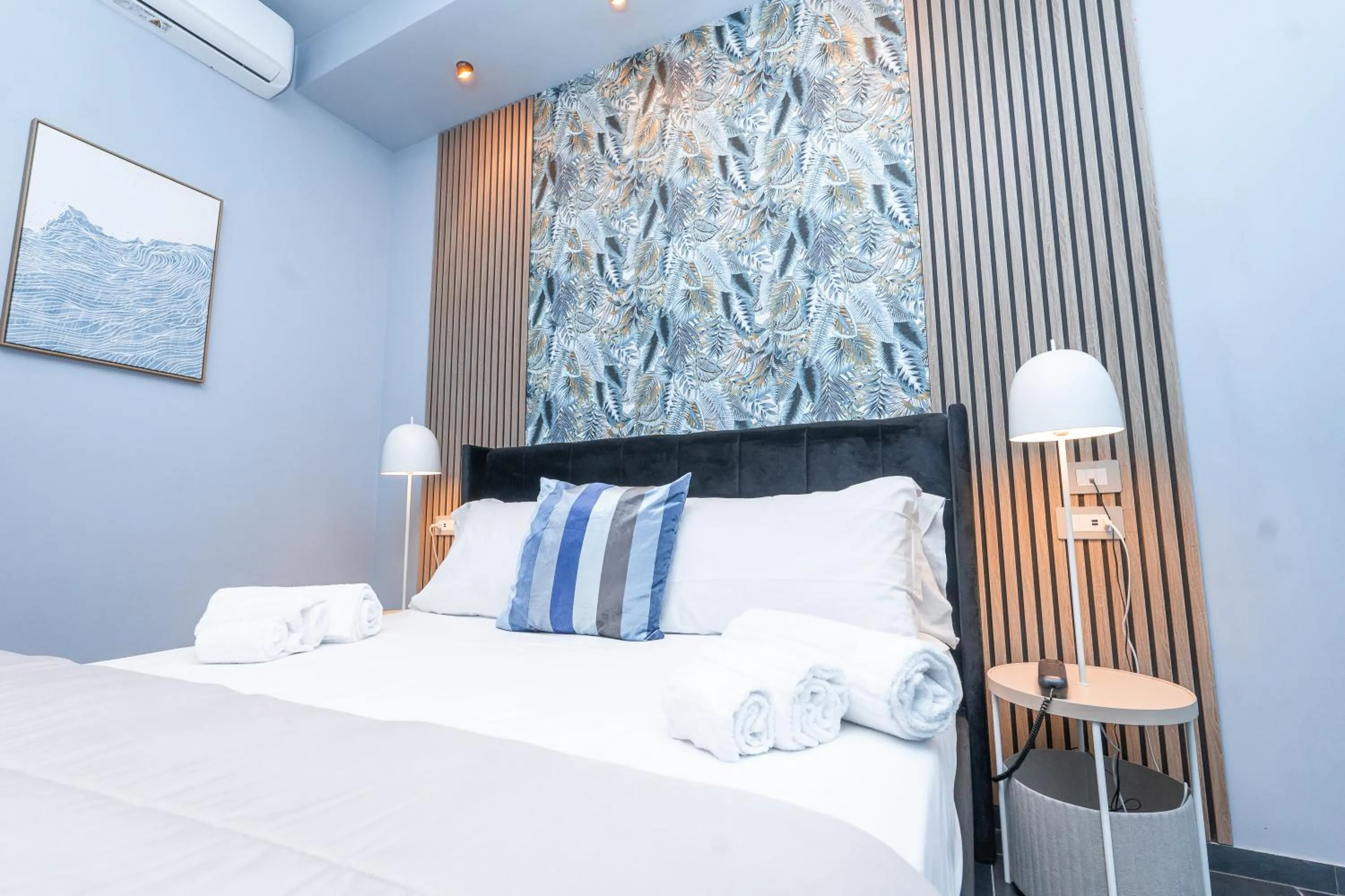 Bed in Noah Gate Hotel & Suites
