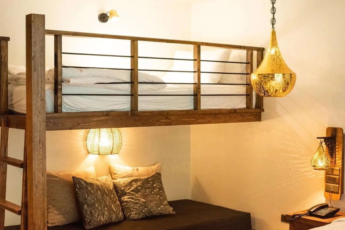 Seating area, Bed in Tints of Blue Hotel