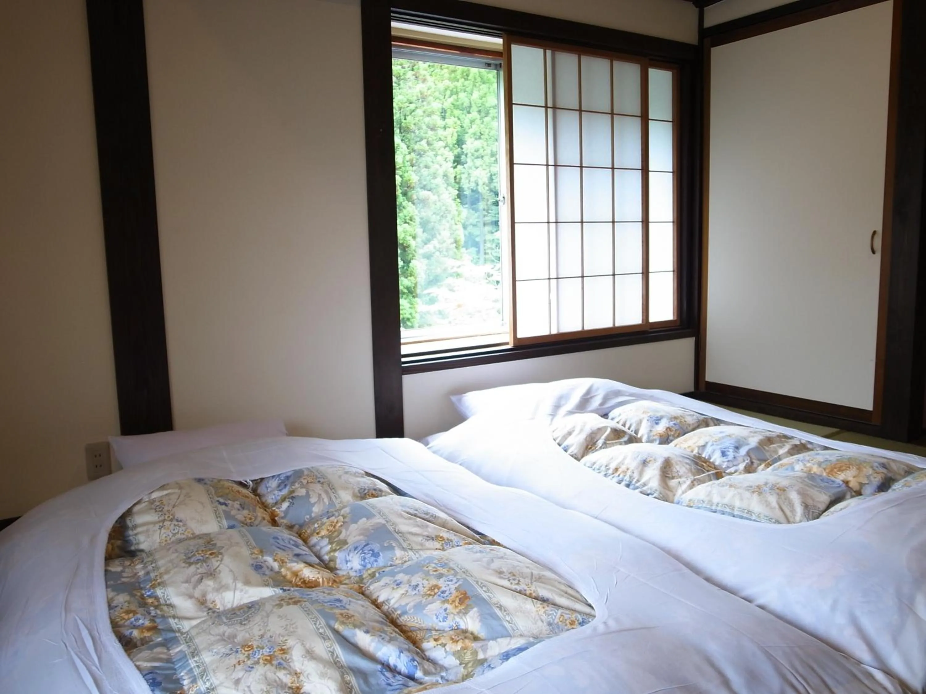 Bed in Minshuku Takizawa