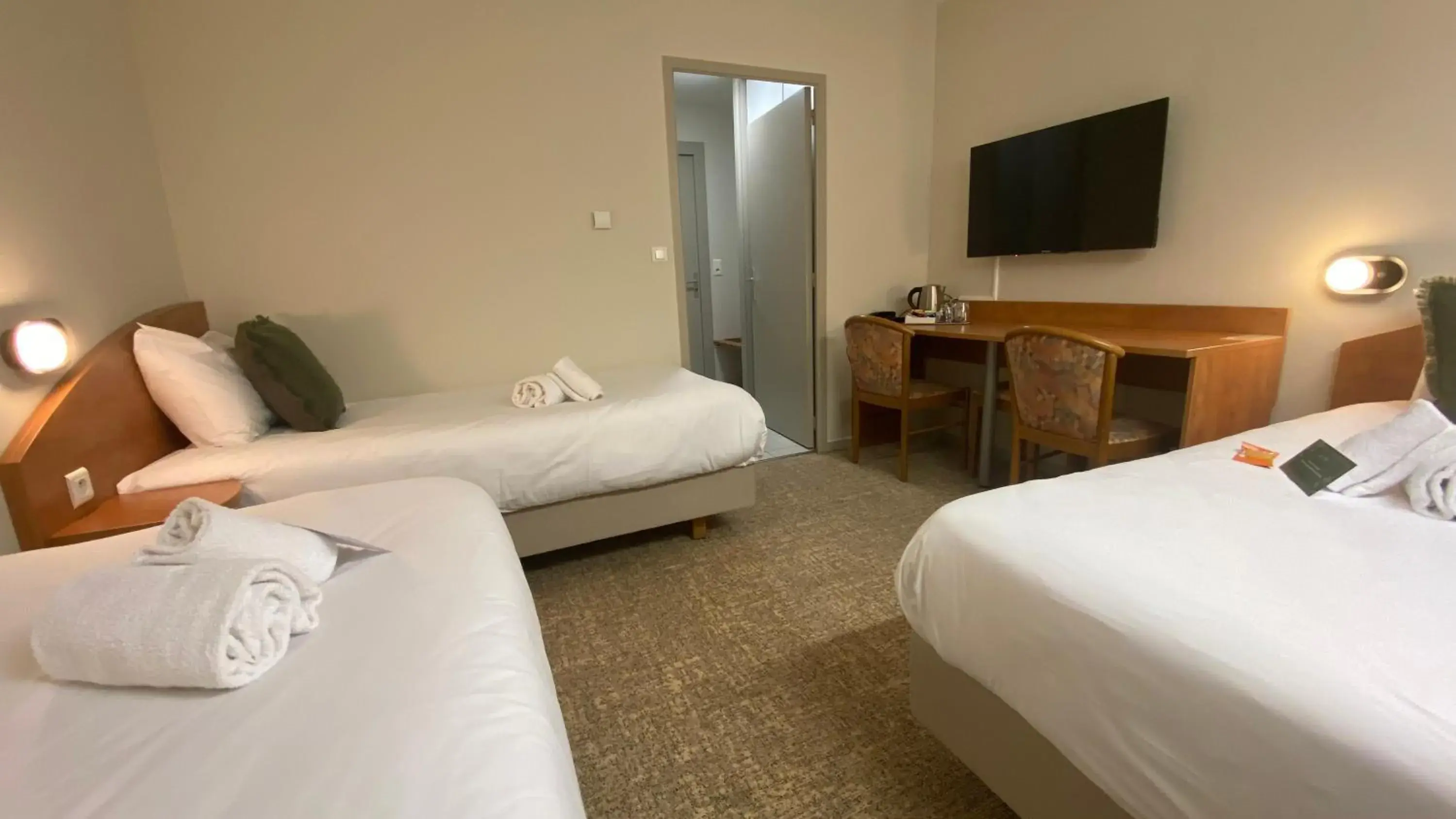 Communal lounge/ TV room, Bed in The Originals City, Logis d'Elbée, Cholet Nord Communal lounge/ TV room, Bed in The Originals City, Logis d'Elbée, Cholet Nord