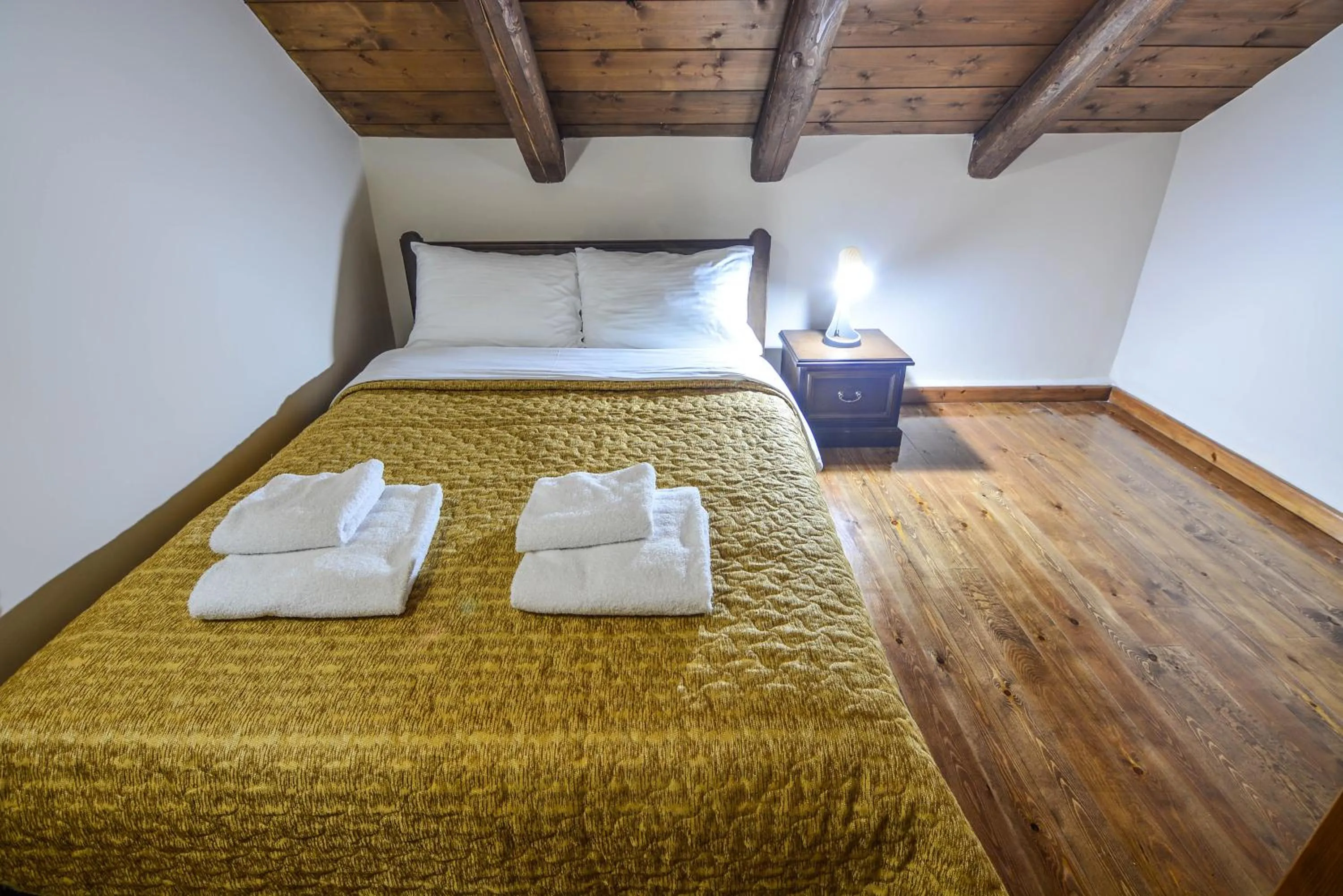 Bed in Hotel Iliovasilema