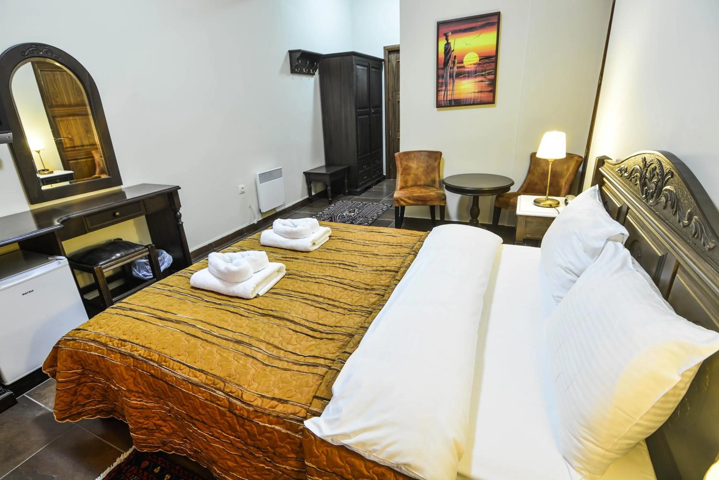 Bed in Hotel Iliovasilema