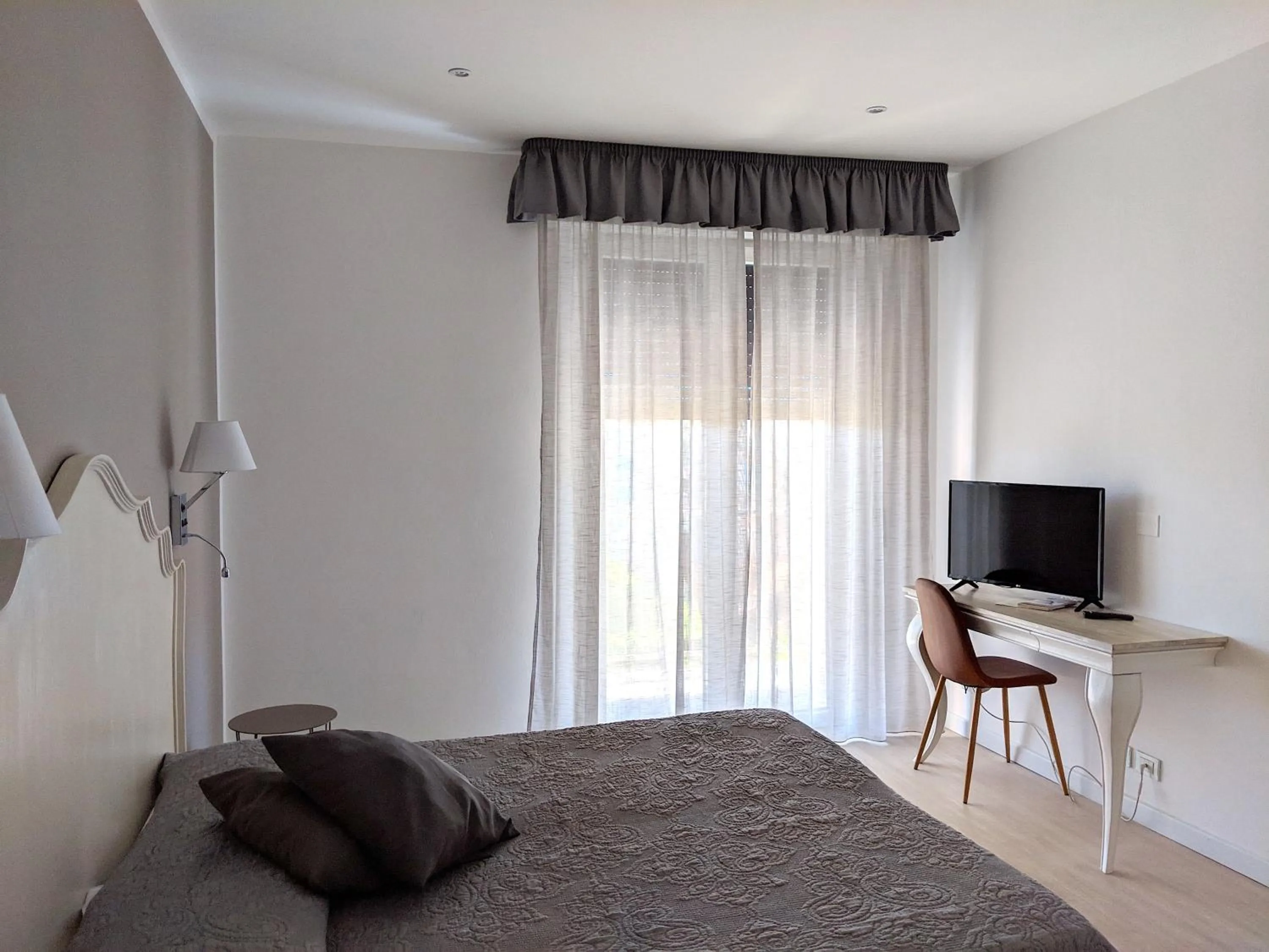 Bed in Hotel Piccolo Mondo