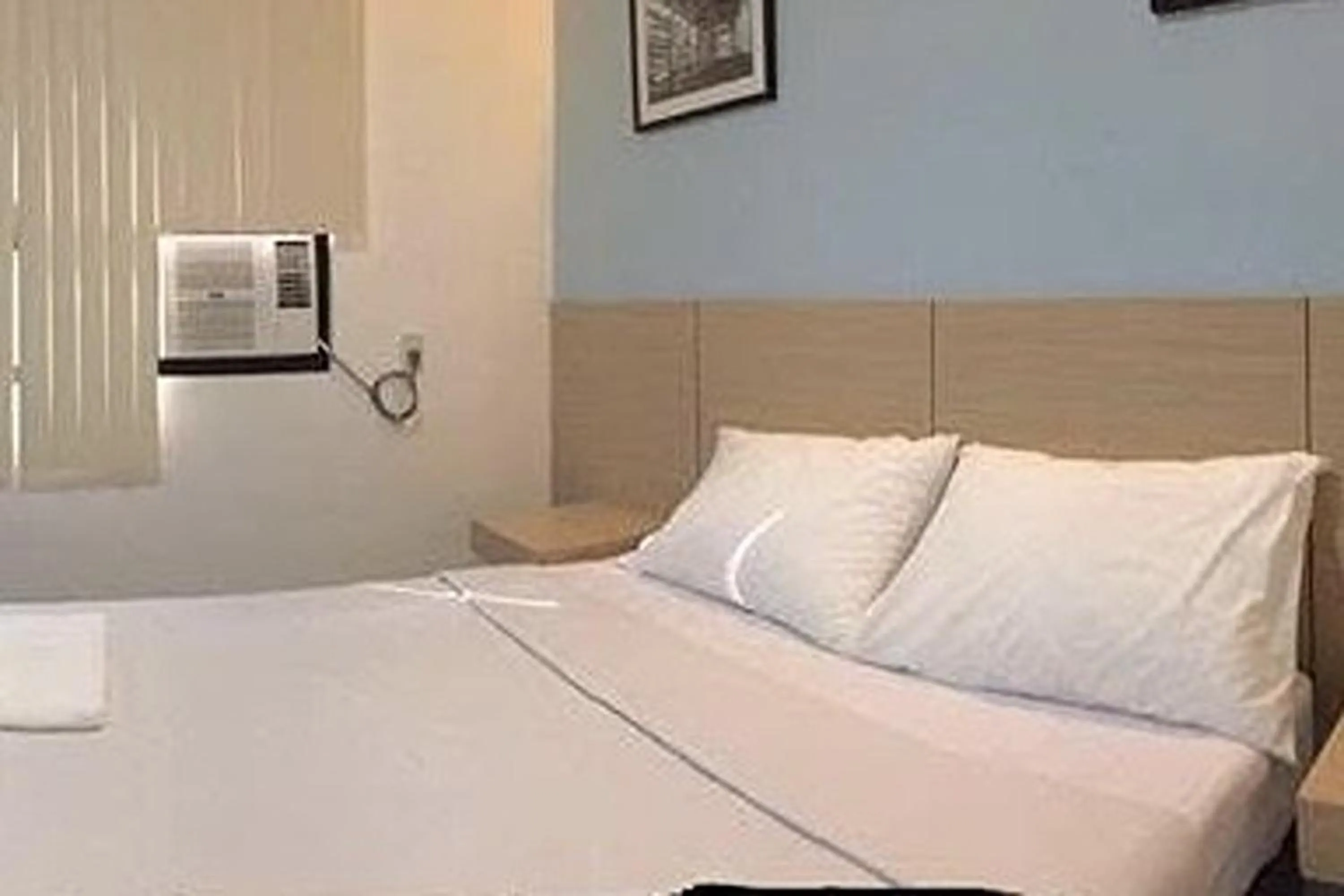 Bed in Alchan Suites