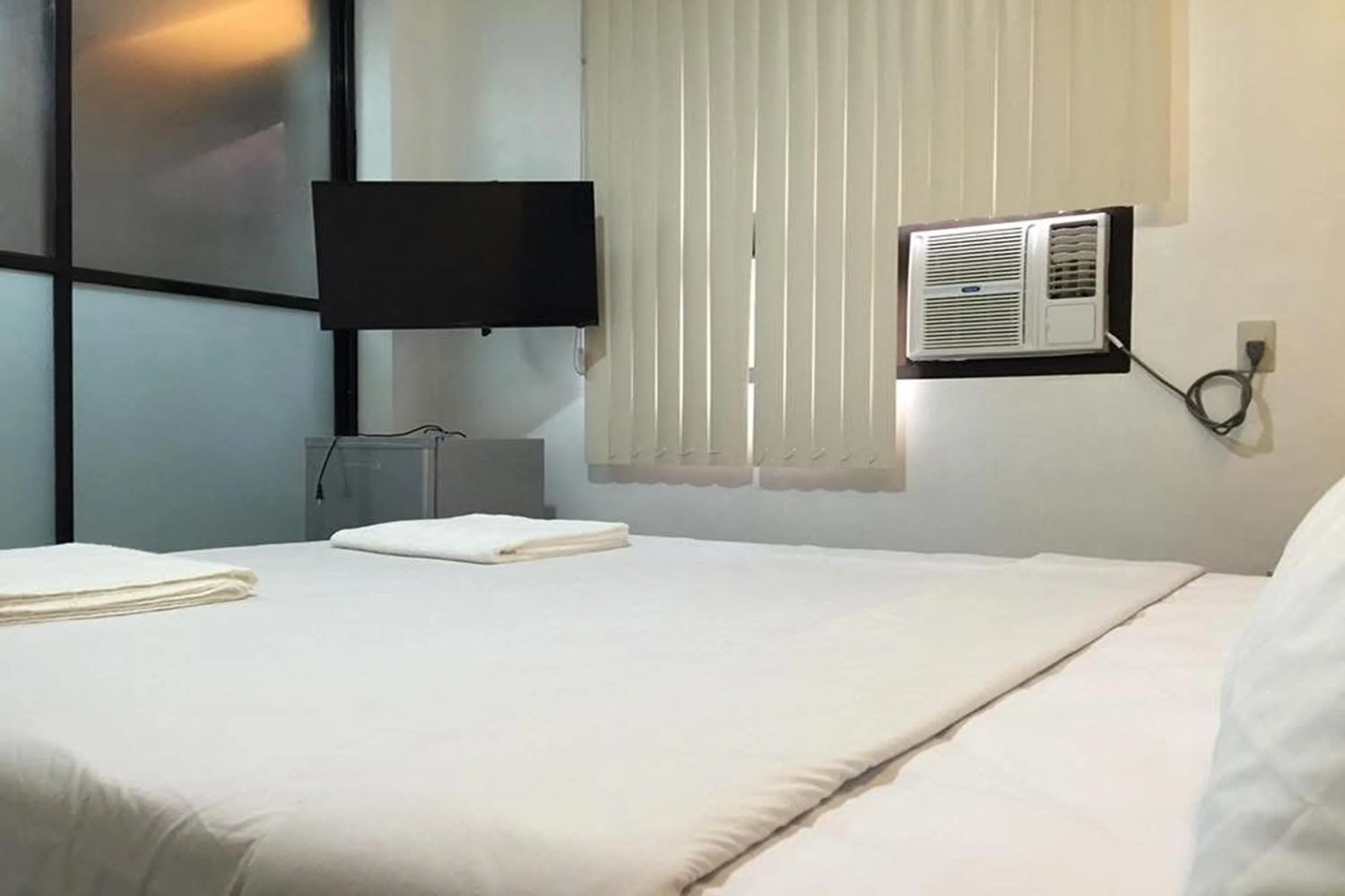 Bed in Alchan Suites