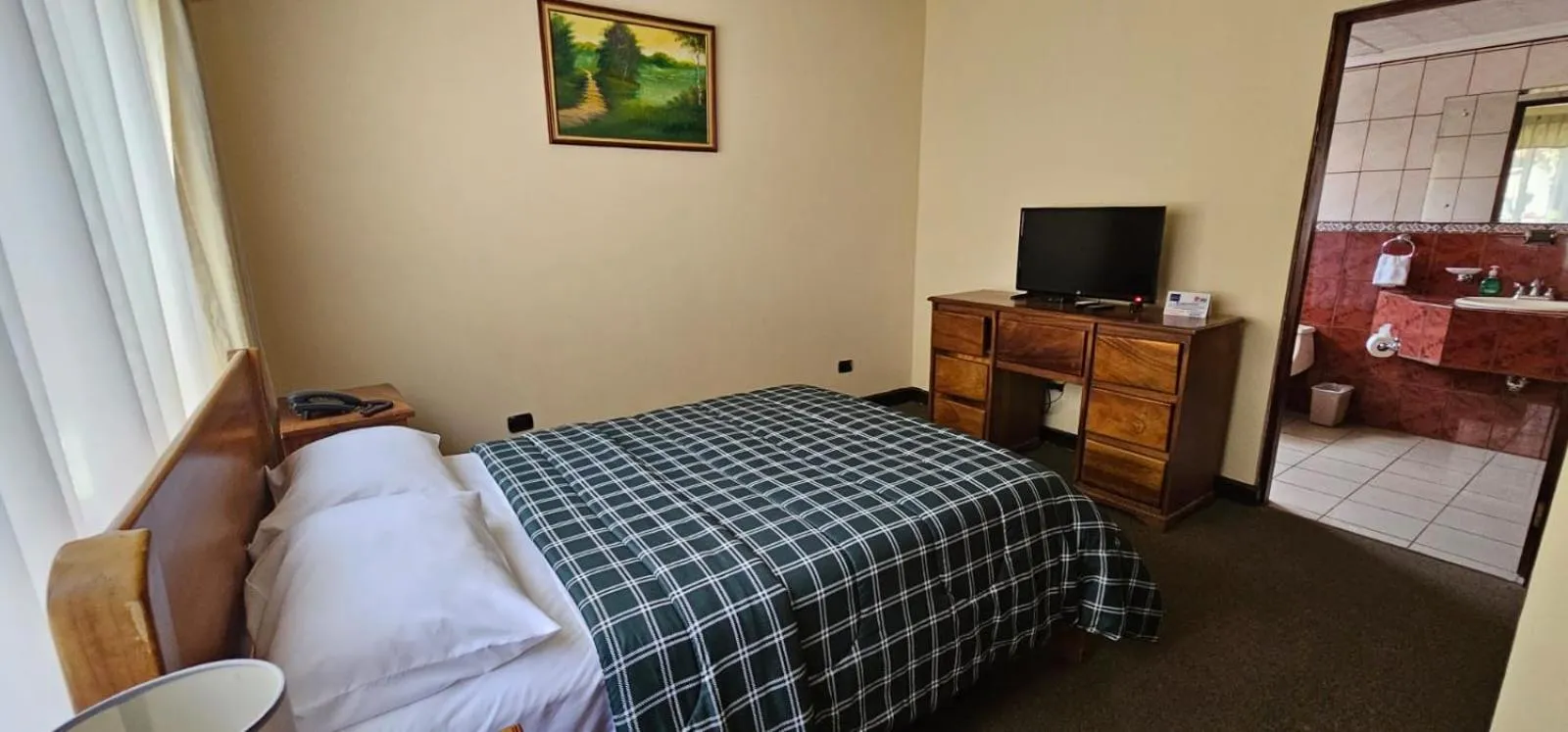 Bed in Apartotel Obelisco San José Aeropuerto