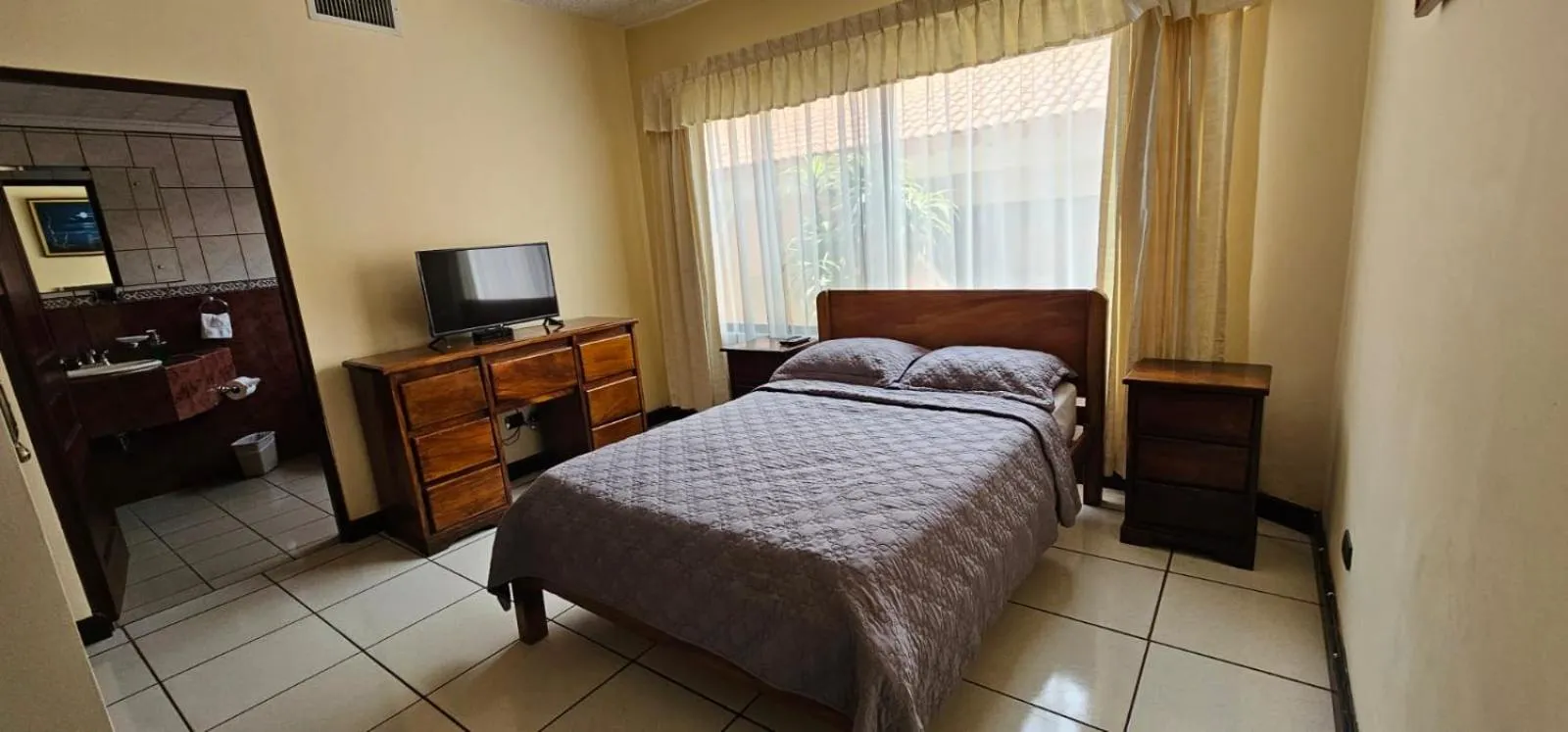 Bed in Apartotel Obelisco San José Aeropuerto