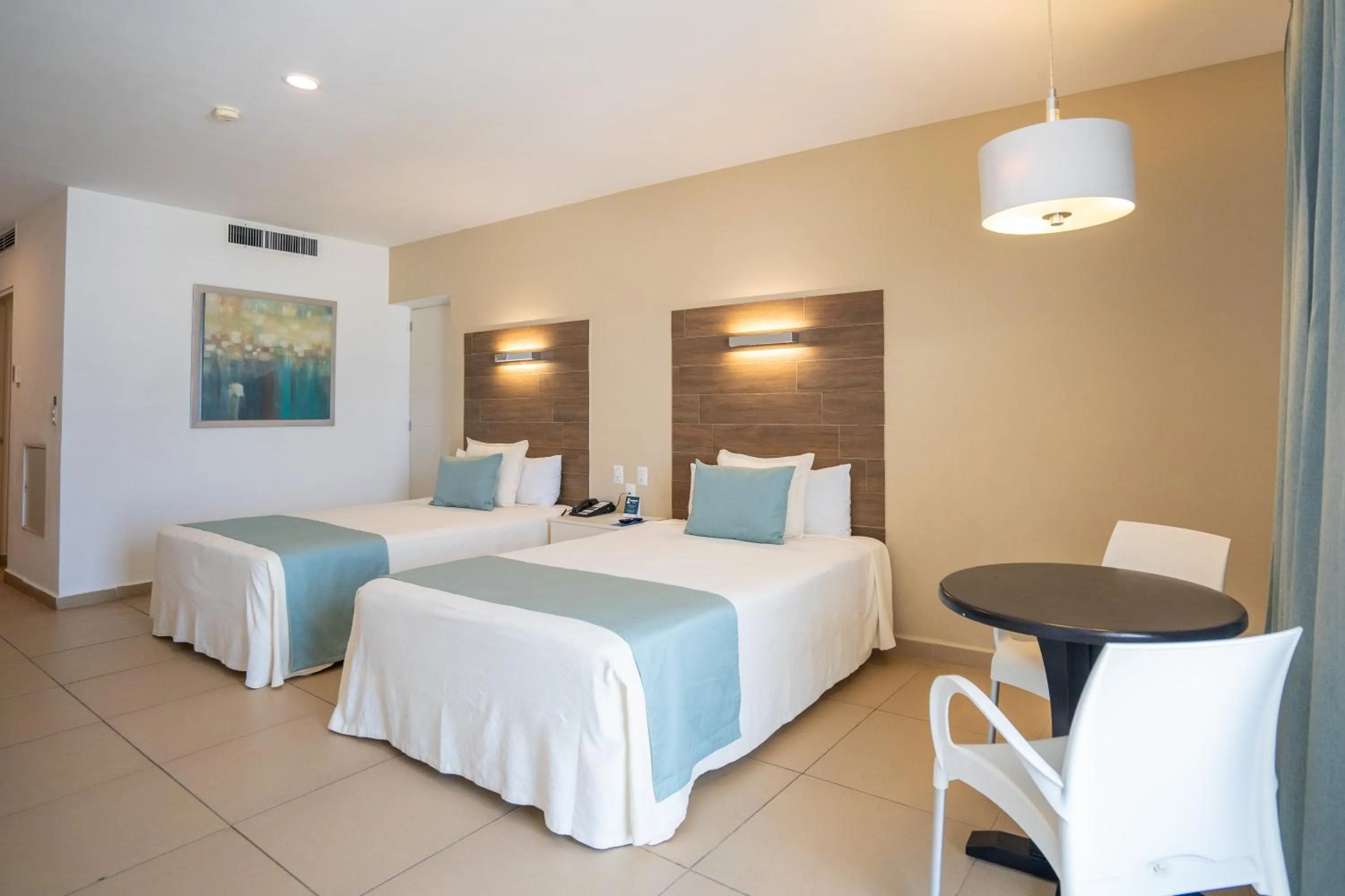 Bed in Pacific Palace Beach Tower Hotel