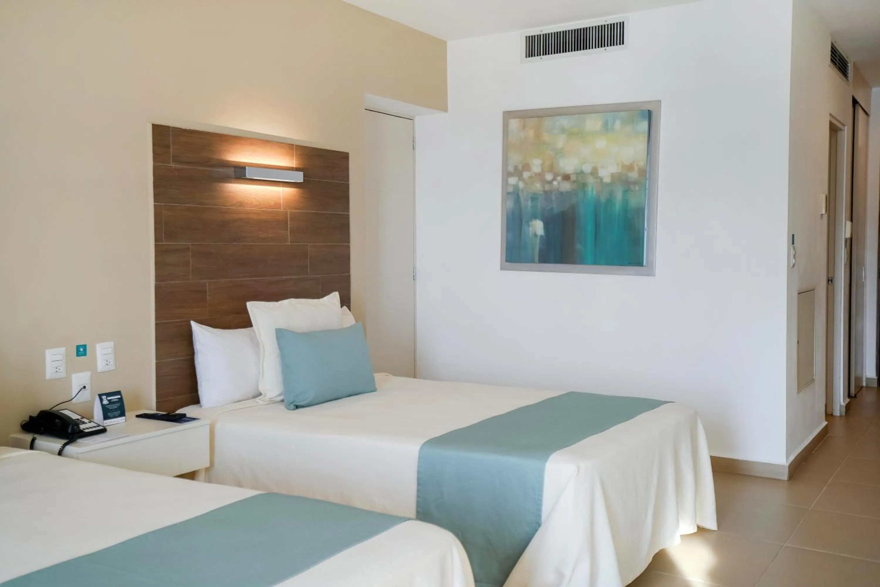 Bed in Pacific Palace Beach Tower Hotel