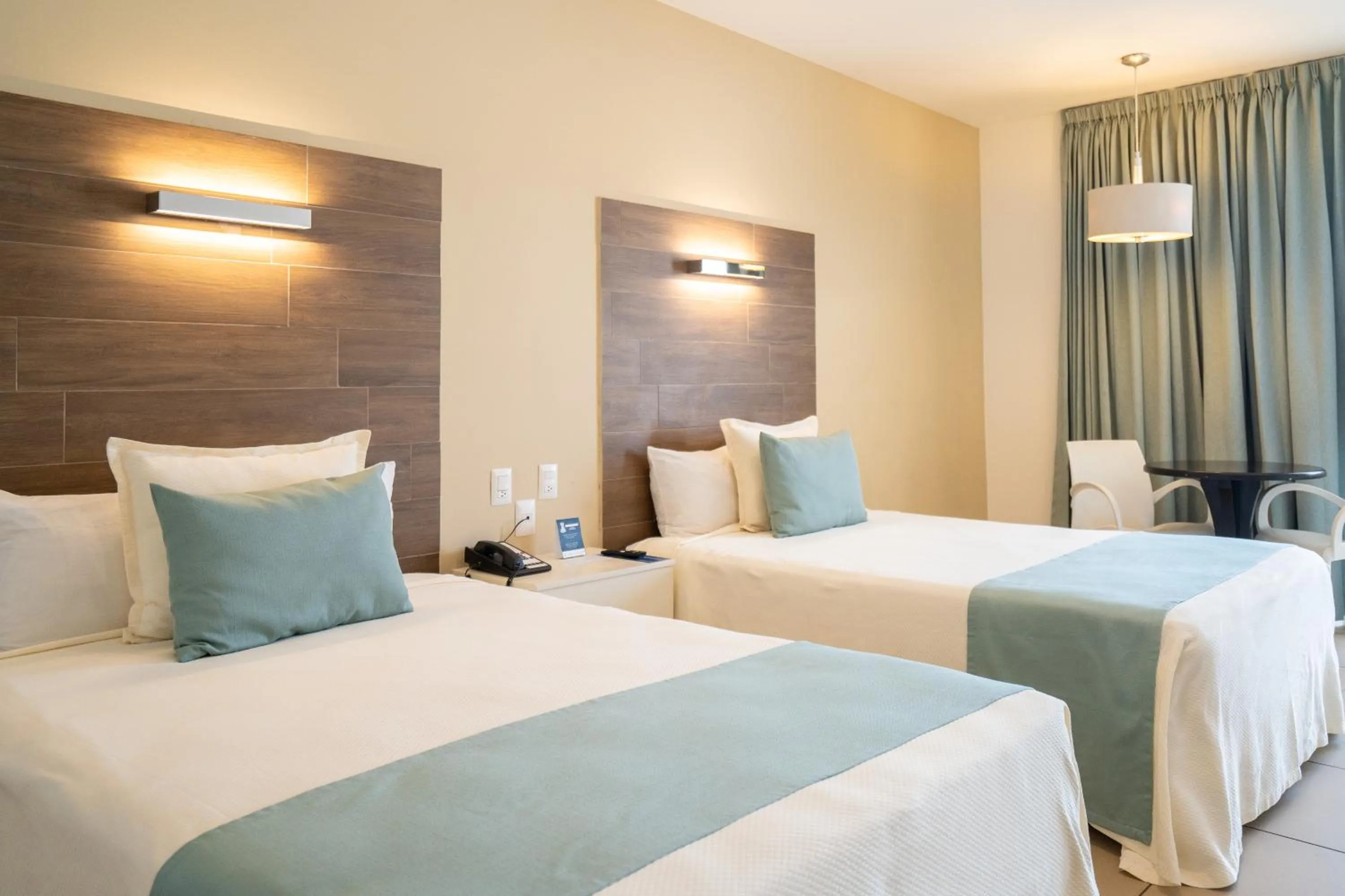 Bed in Pacific Palace Beach Tower Hotel