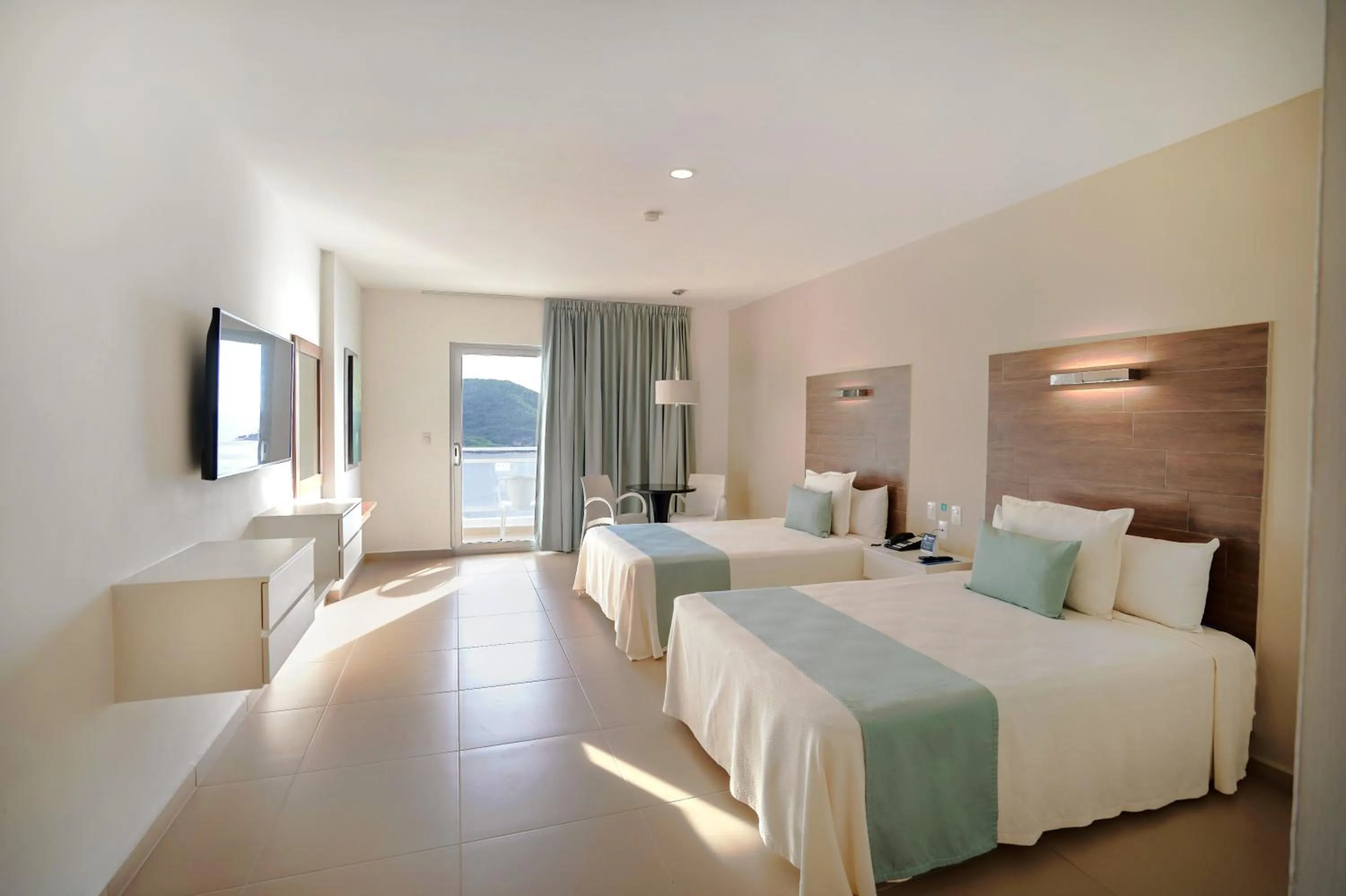 Photo of the whole room, Bed in Pacific Palace Beach Tower Hotel