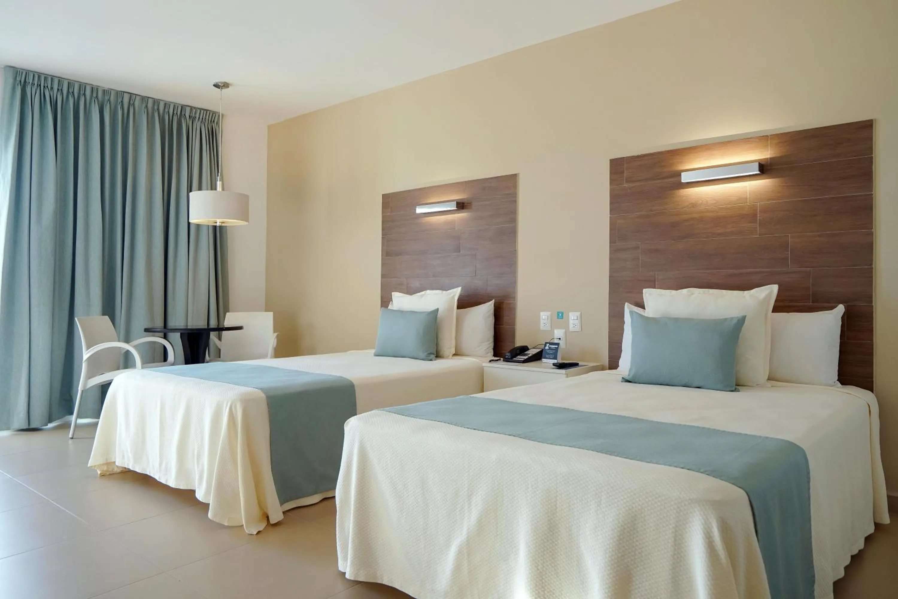 Bed in Pacific Palace Beach Tower Hotel