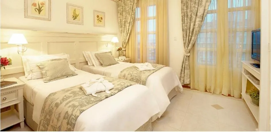 Bed in Il Campanario Villaggio Resort