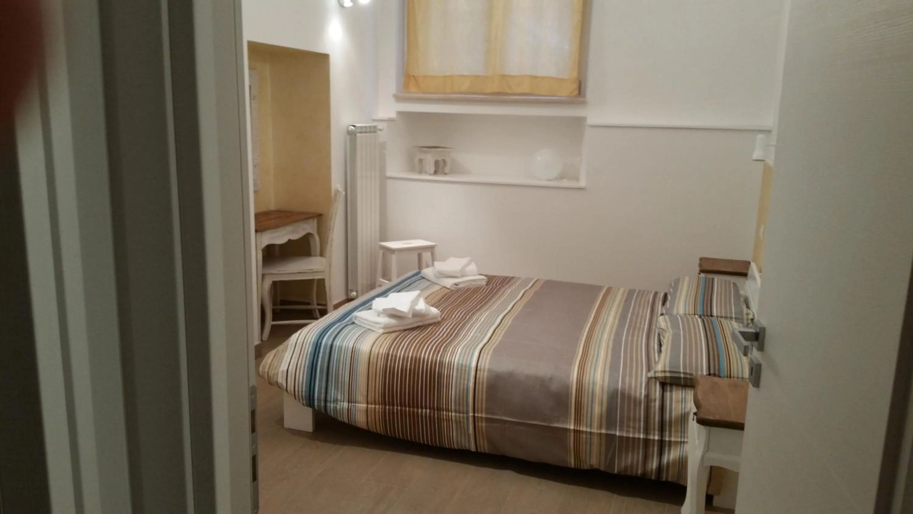Photo of the whole room, Bed in La Casetta di Ely