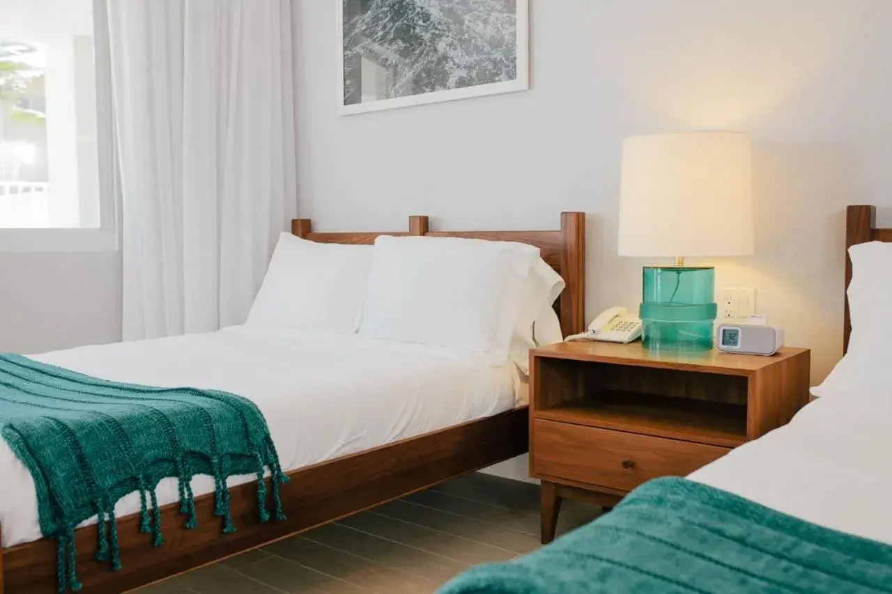 Bed in Tides Inn Hotel Bed in Tides Inn Hotel