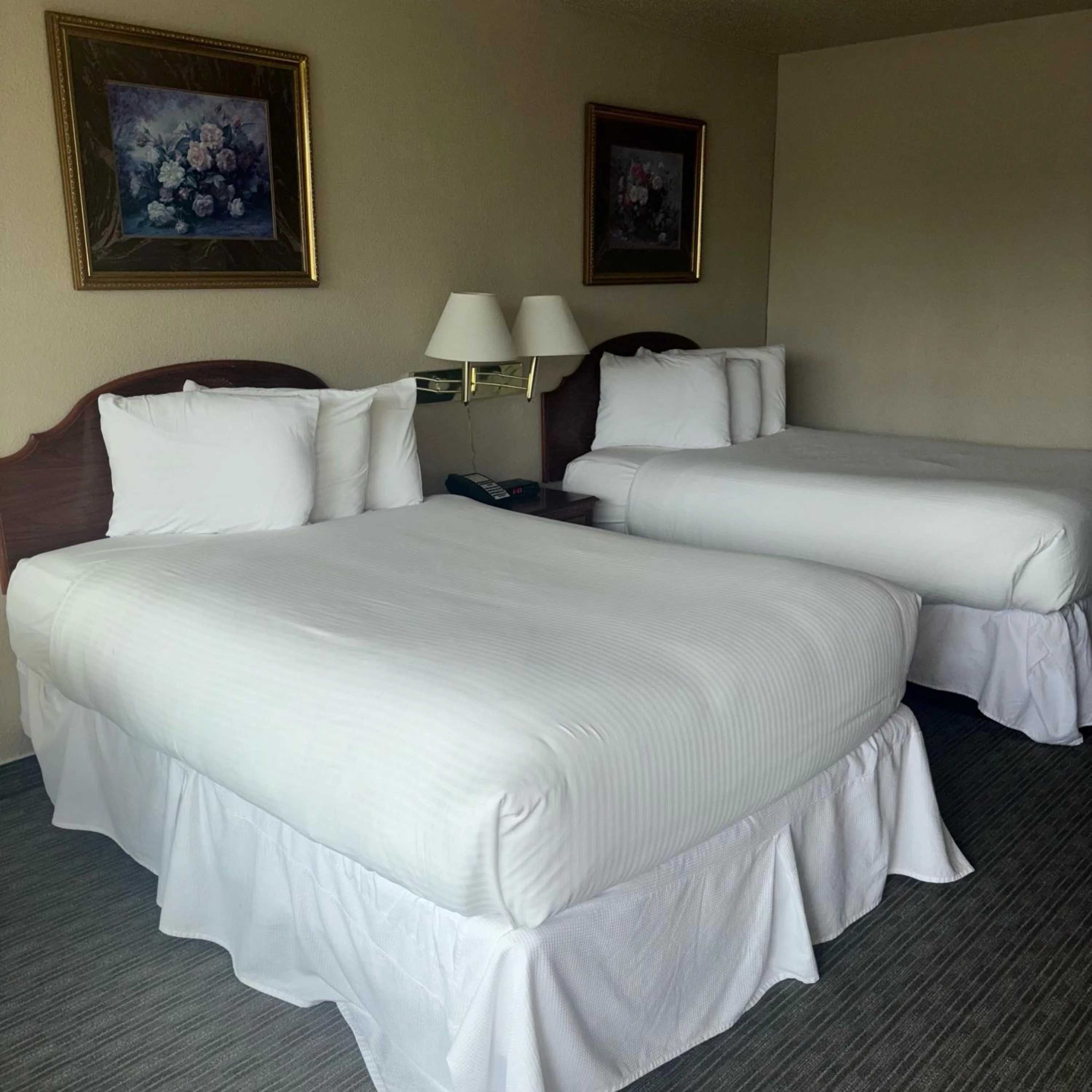 Bed in Unique Suites Hotel