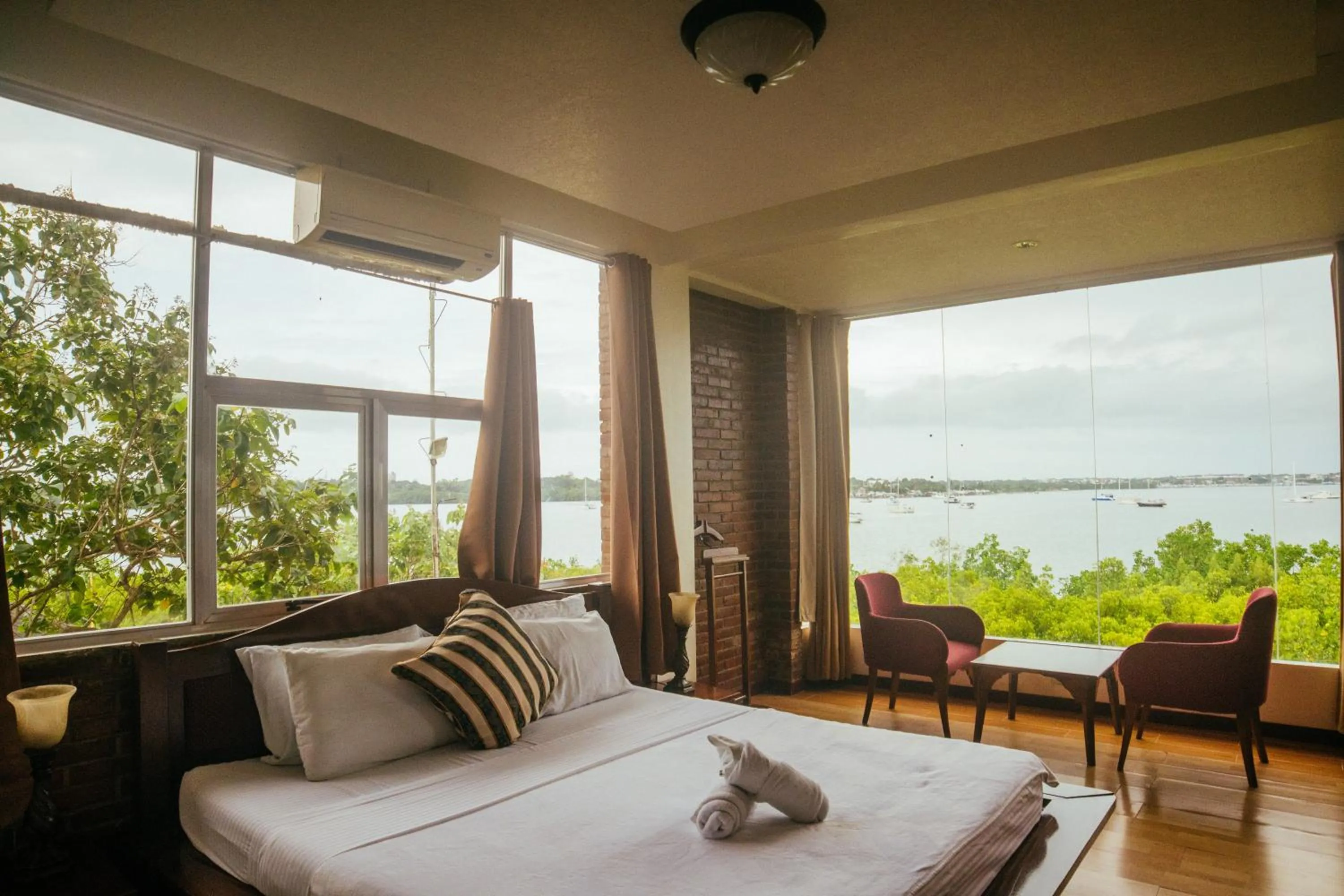 Bed in Marina Palawan Boutique Nature Resort