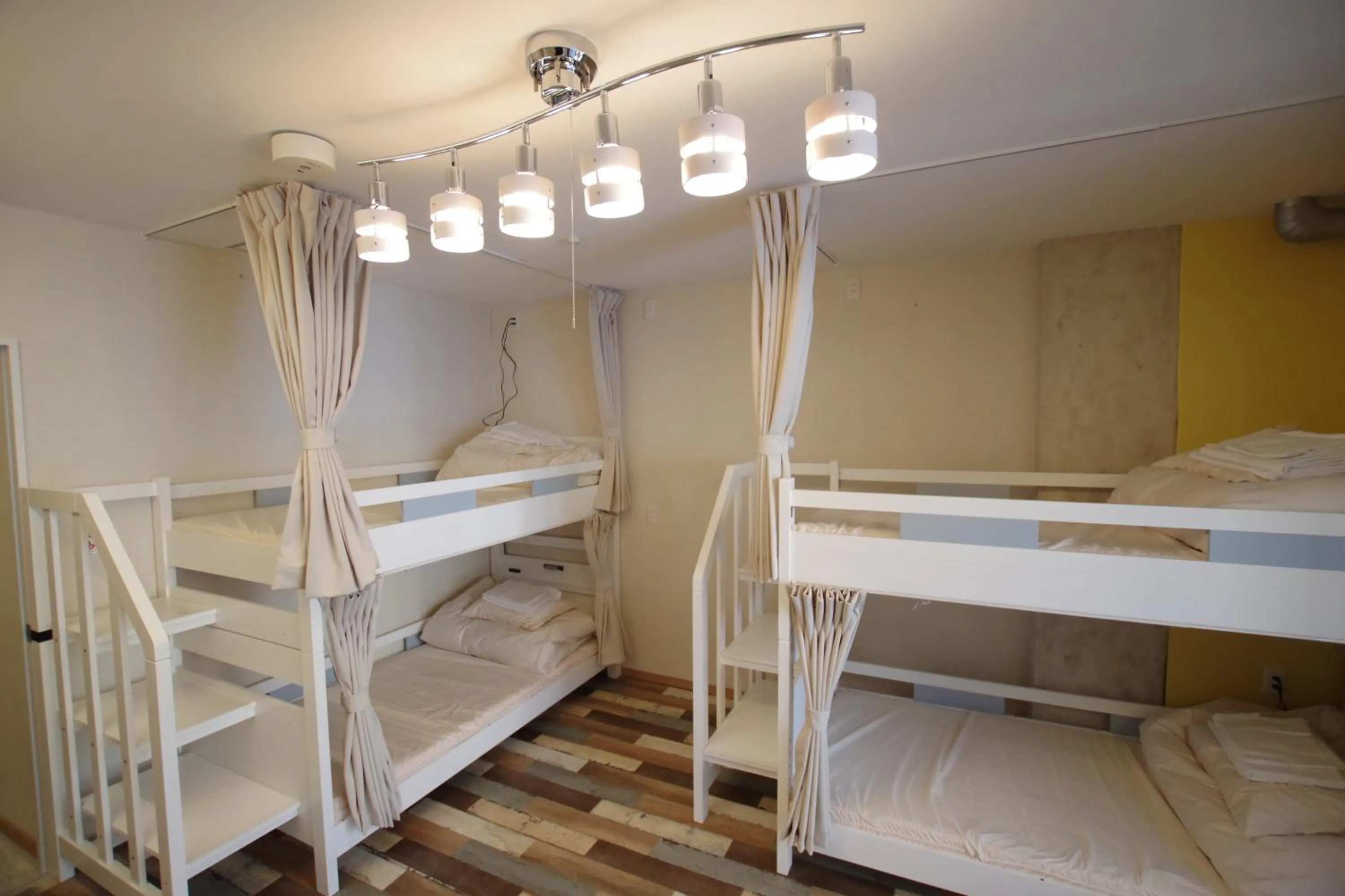 Bed in Cinnamon Guesthouse Dogo