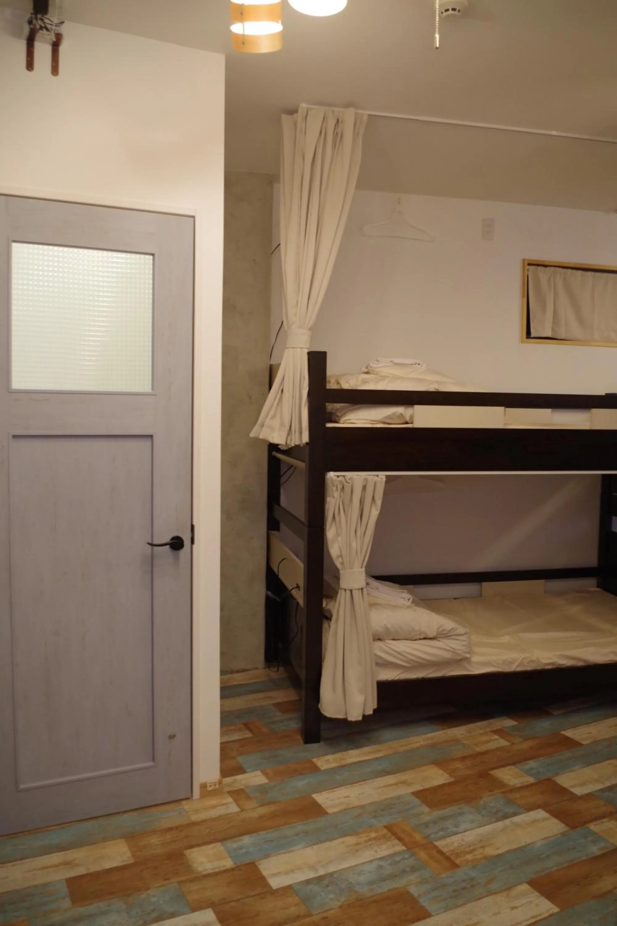 Bed in Cinnamon Guesthouse Dogo