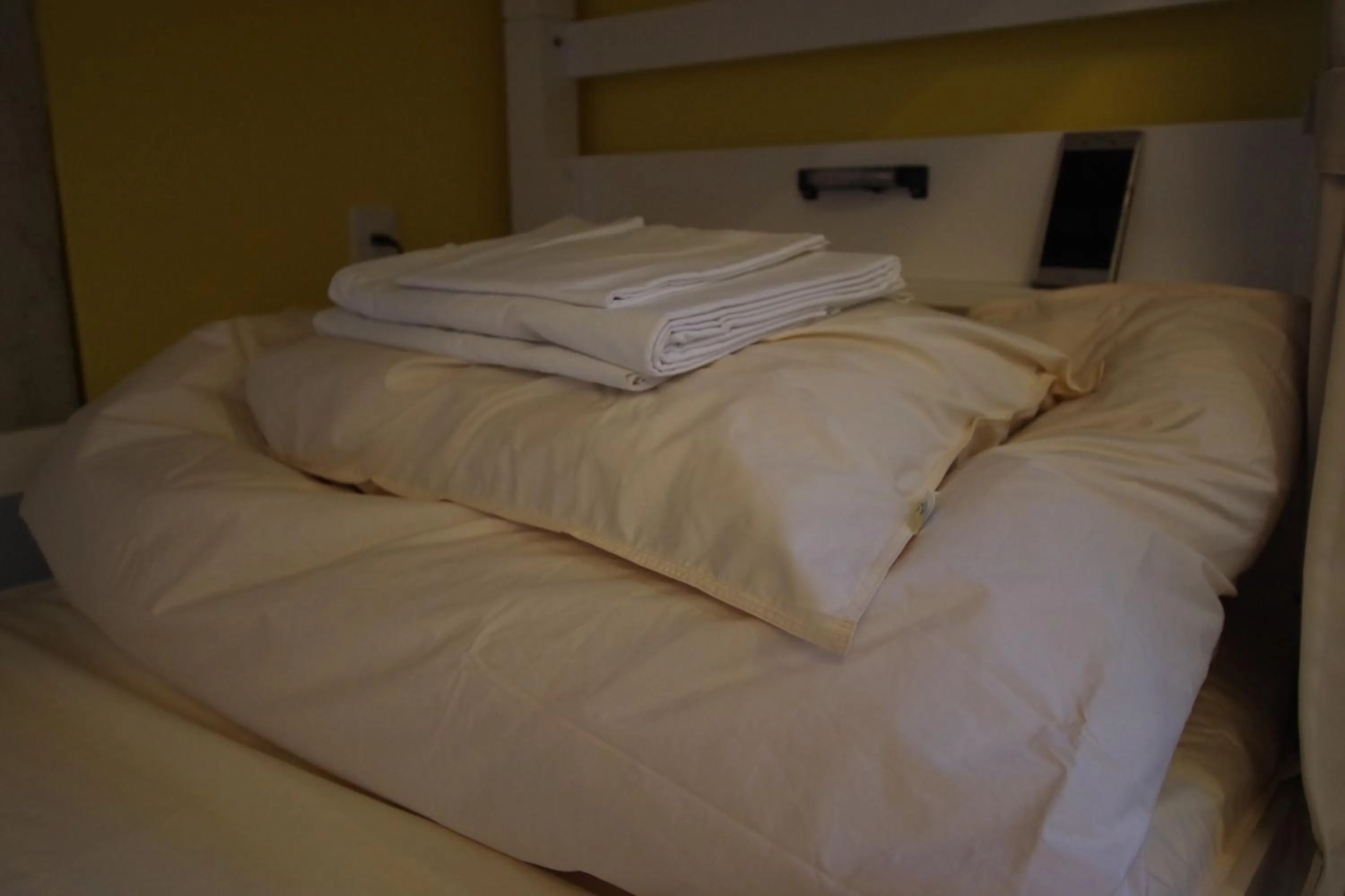 Bed in Cinnamon Guesthouse Dogo